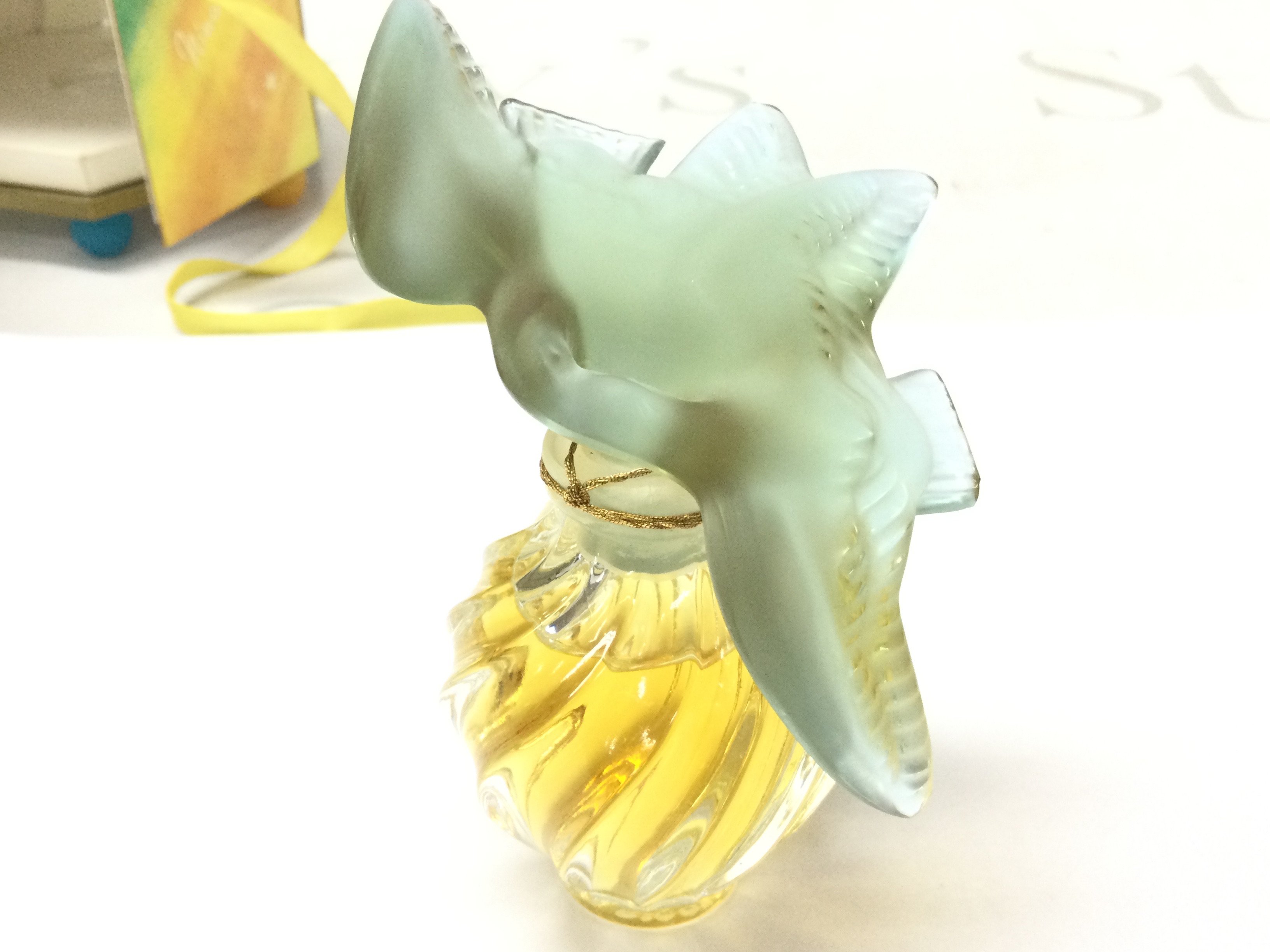 A boxed Nina Ricci L Air Du Temps 15 ml New Lalique Doves Green Perfume Bottle. This lot cannot be posts