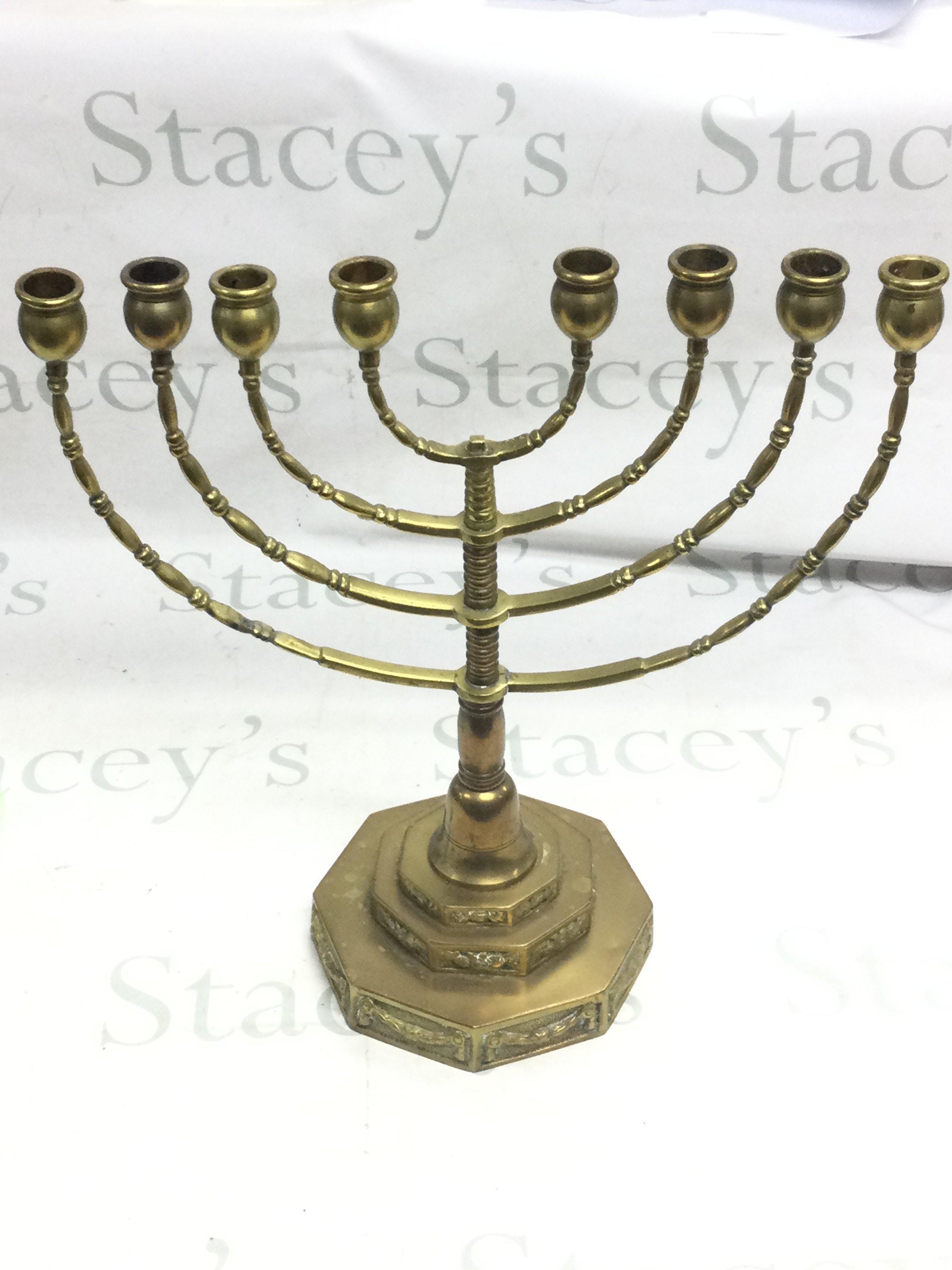 A brass Menorah 41cm tall 38cm wide . Postage category C