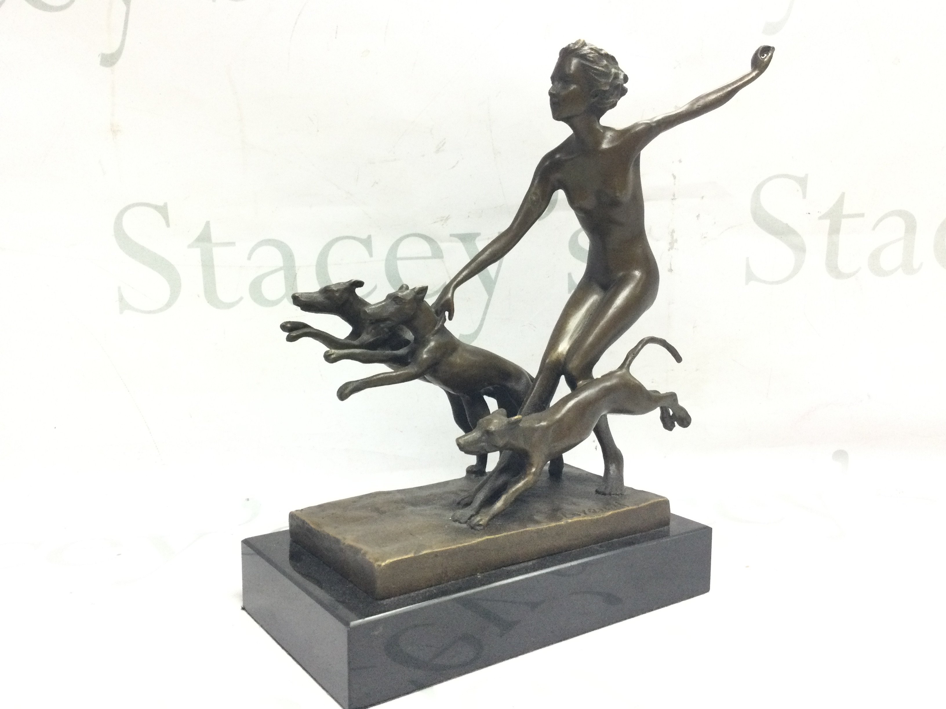 An Art Deco style Lorenzl Diane bronze figure , woman with three greyhounds. 24cm tall 18Cm wide. Postage category B