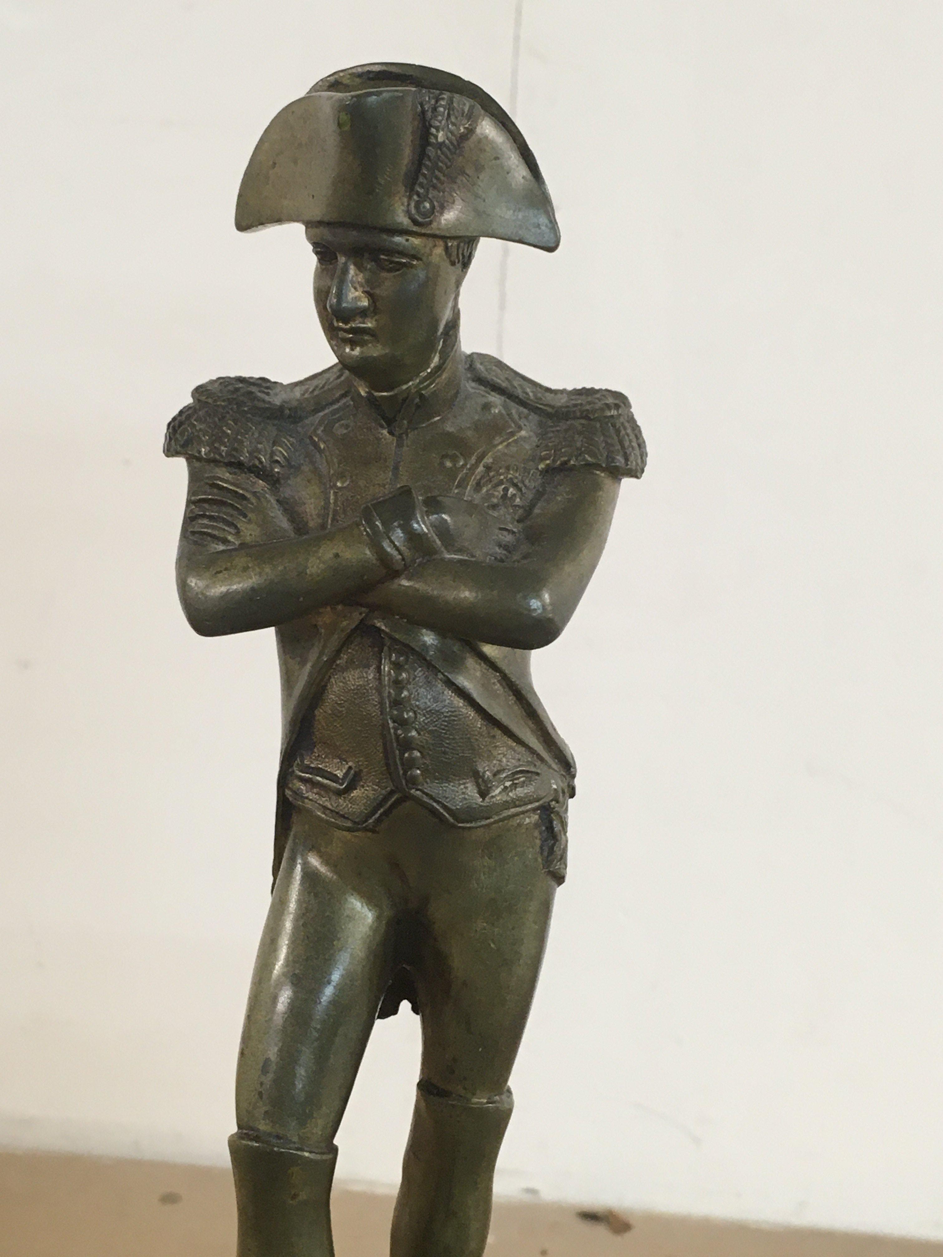 A brass figure of Napoleon 33 cm