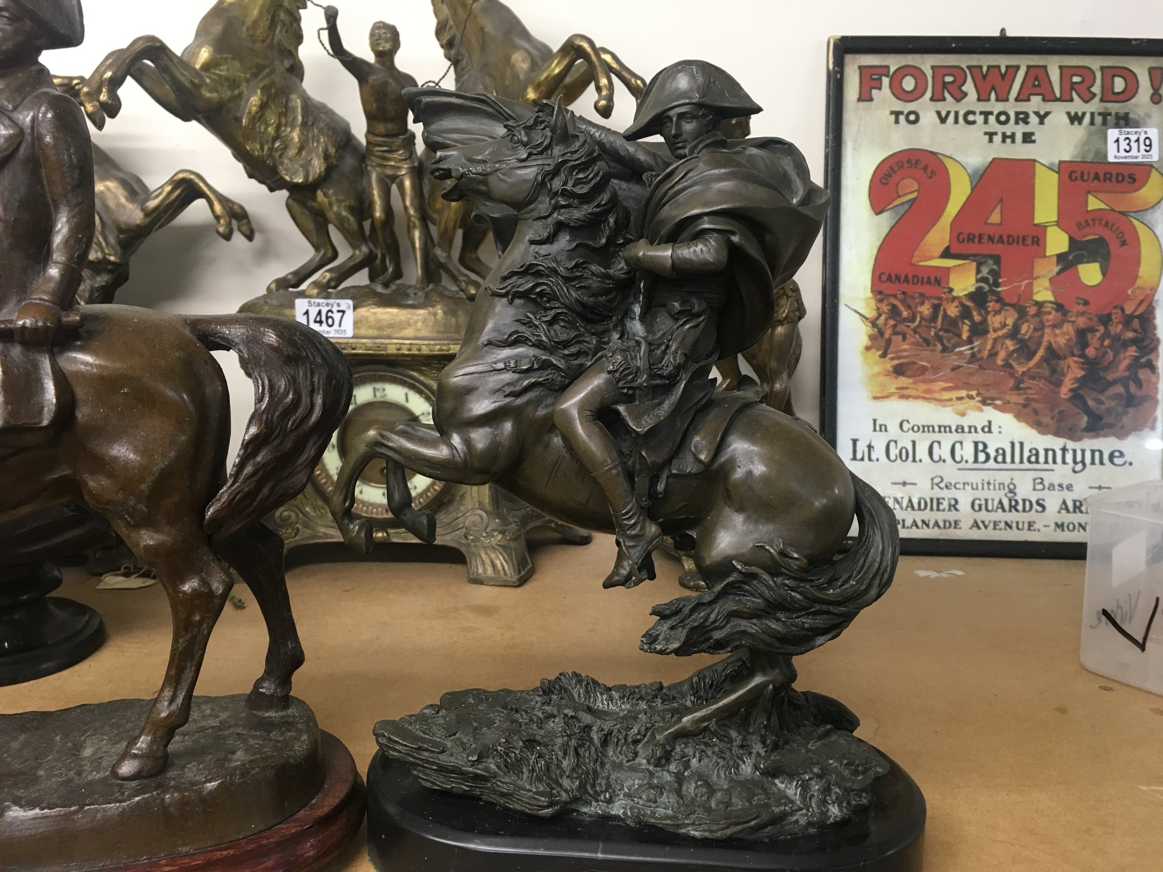 A bronzed figure depicting Napoleon on horseback 30 cm and one other Figure of Napoleon on Horseback. 32 cm .