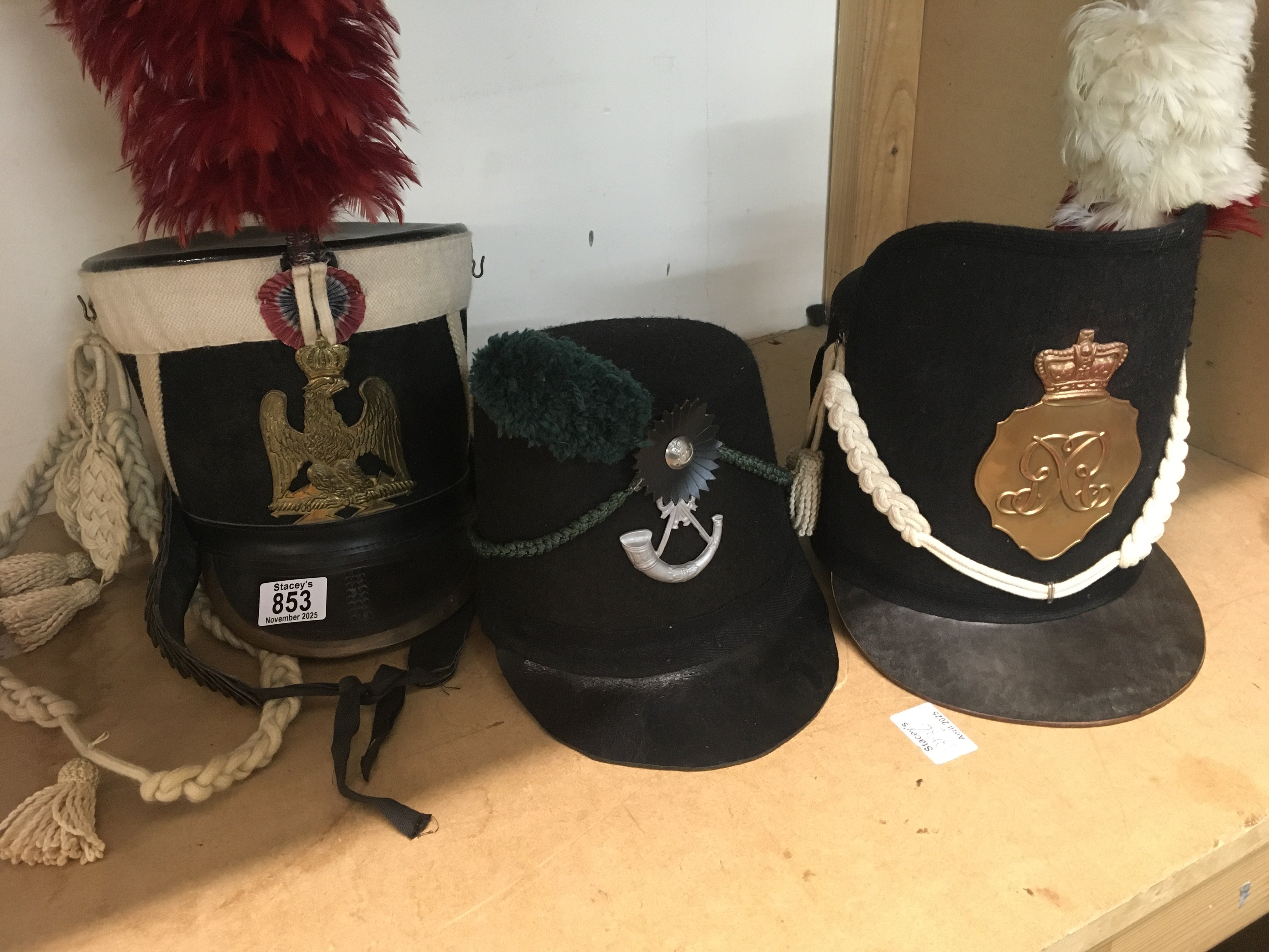 Three Napoleonic Shako style hats .