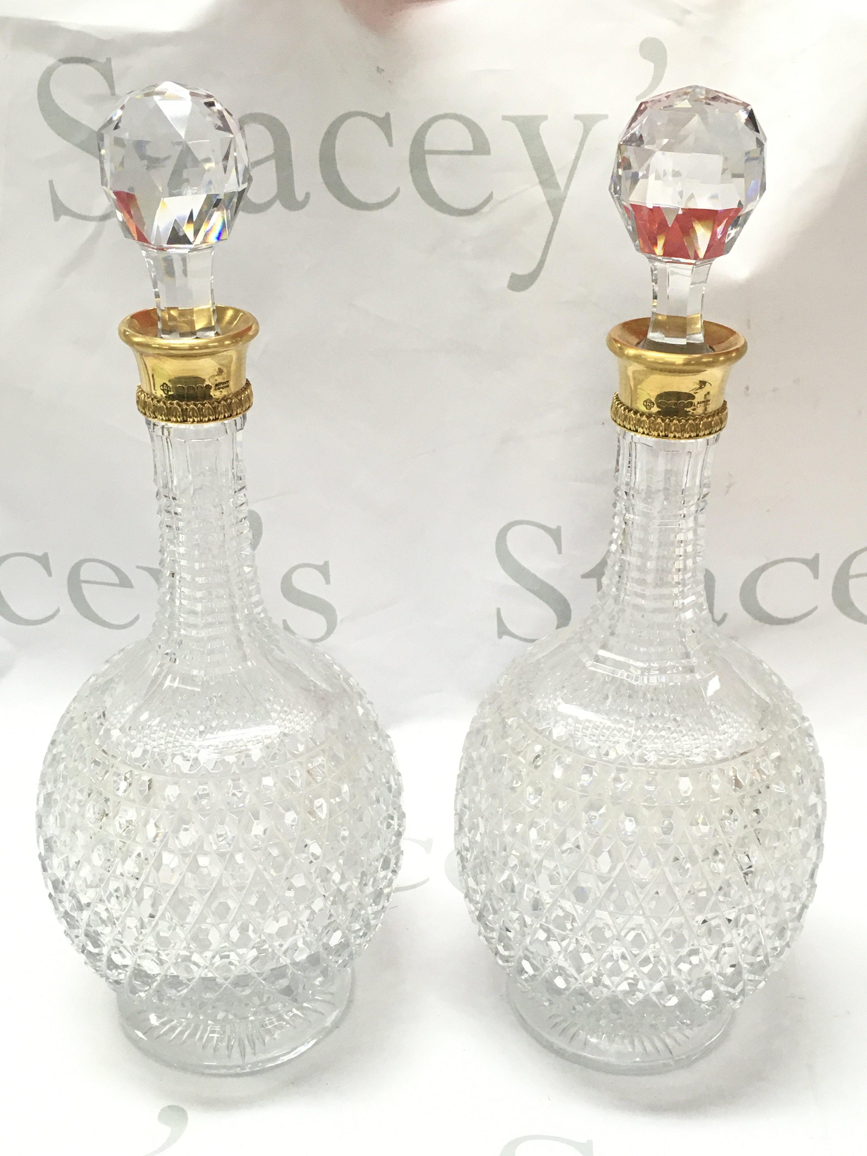 A pair of fine quality 18ct gold rim and cut glass Asprey decanters ,33cm tall. This lot cannot be posted