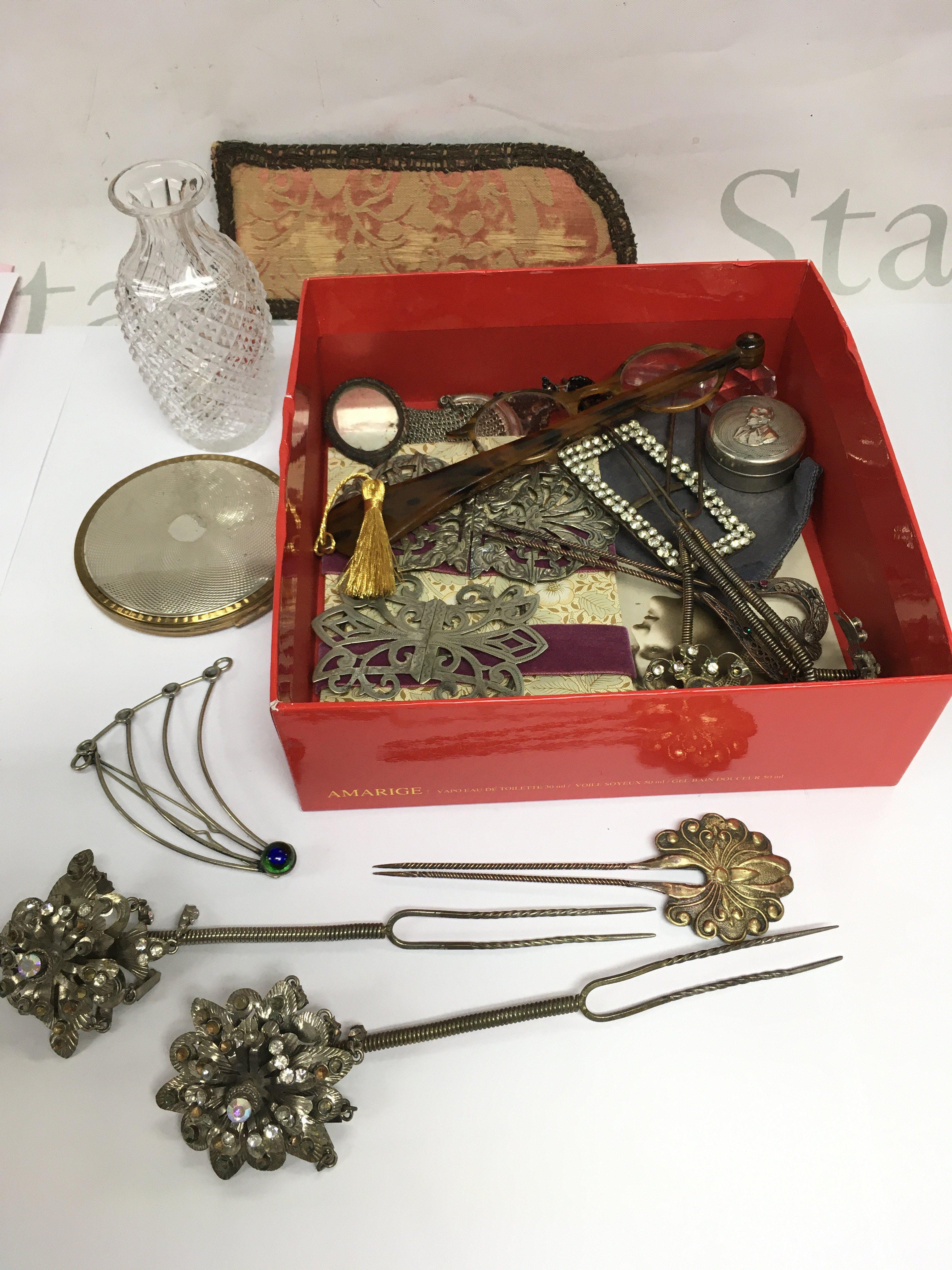 A collection of items comprising vintage Oriental style hat pins, belt buckles, a Stratton compact etc. Shipping category B.