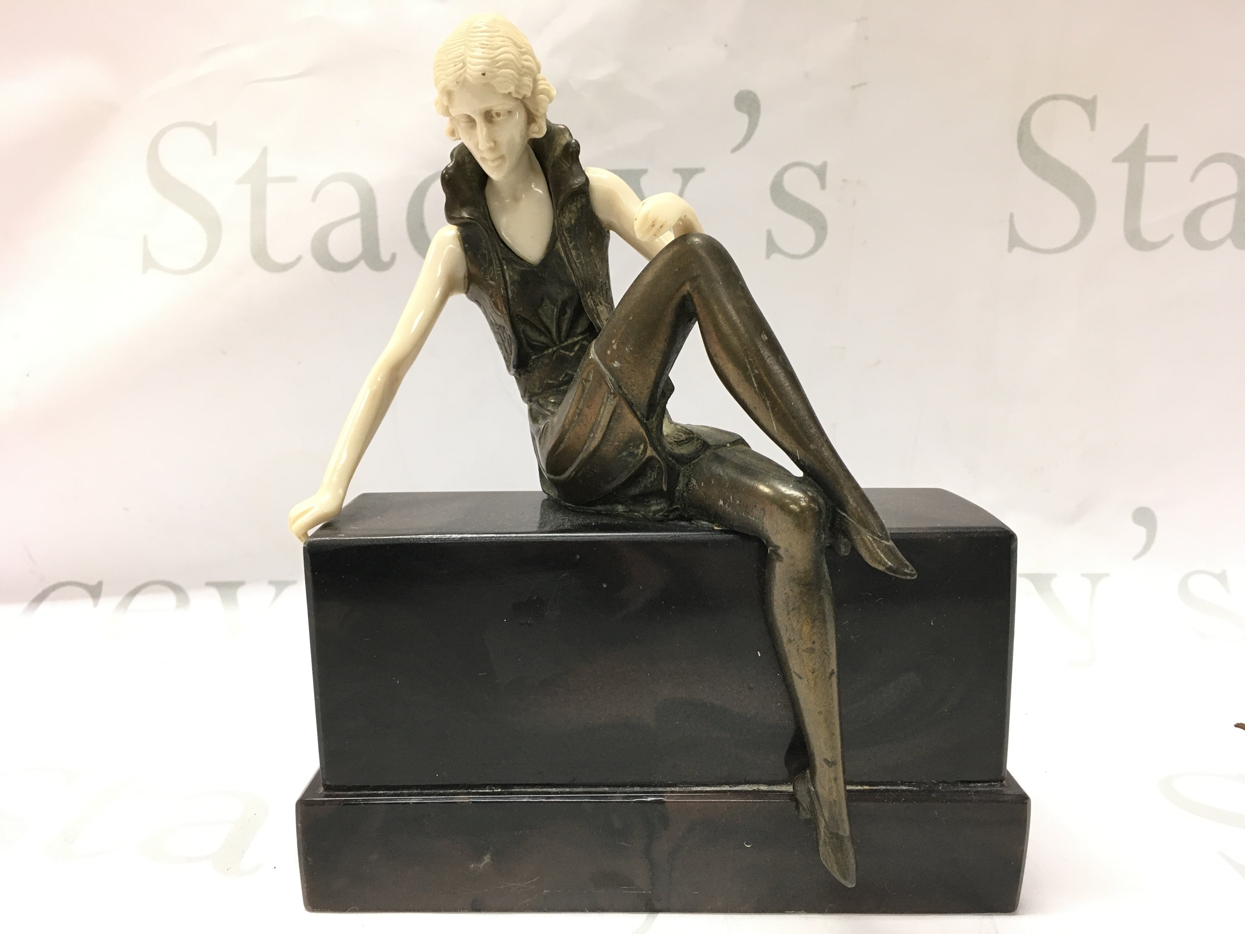 A bronze Art Deco Ferdinand Preiss figure , seated lady on marble base. 22cm tall 18cm wide approximately. Postage category B