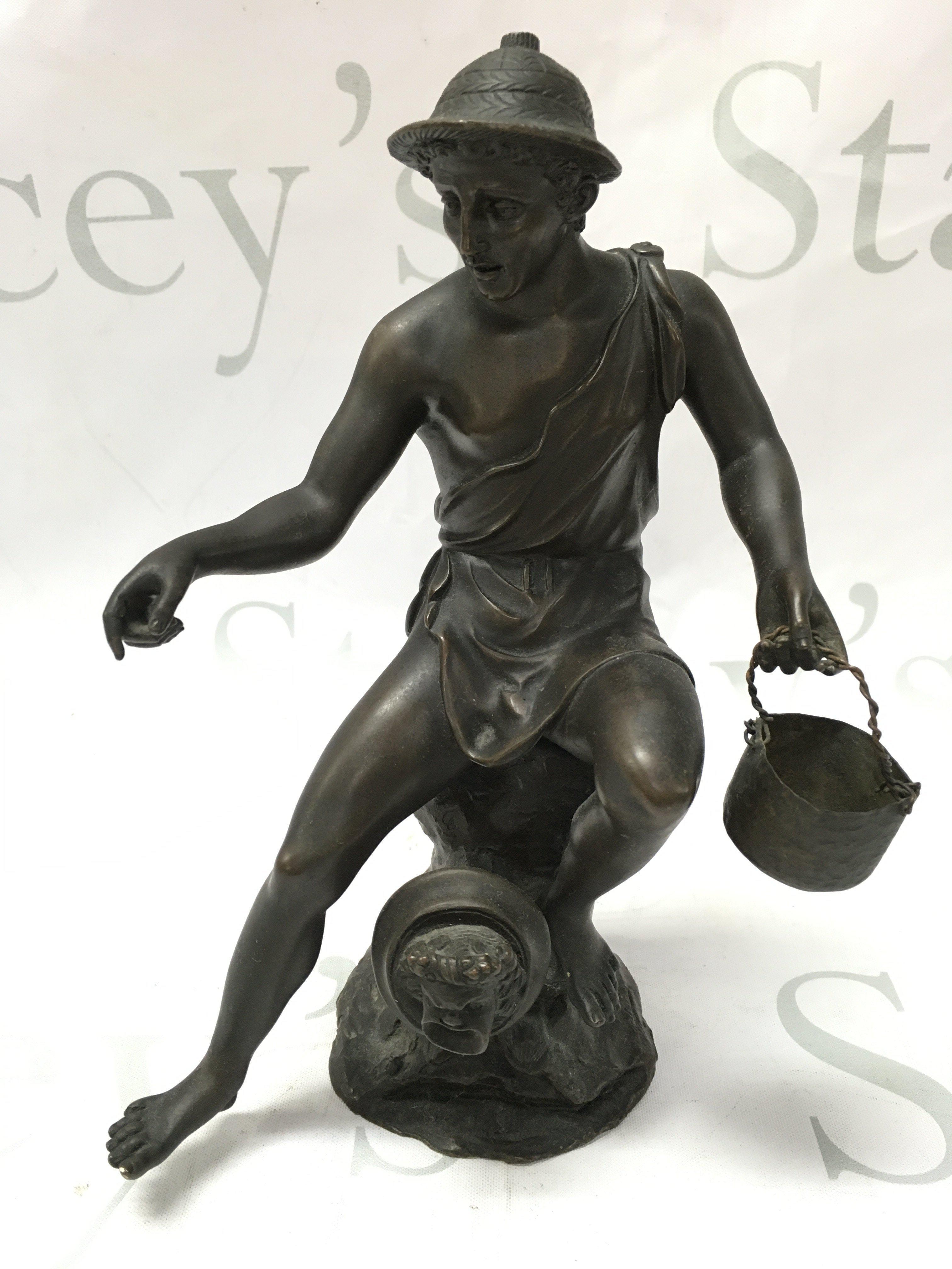 A 19th century bronze of a Neoclassical fisherman. 22cm tall. Postage category B
