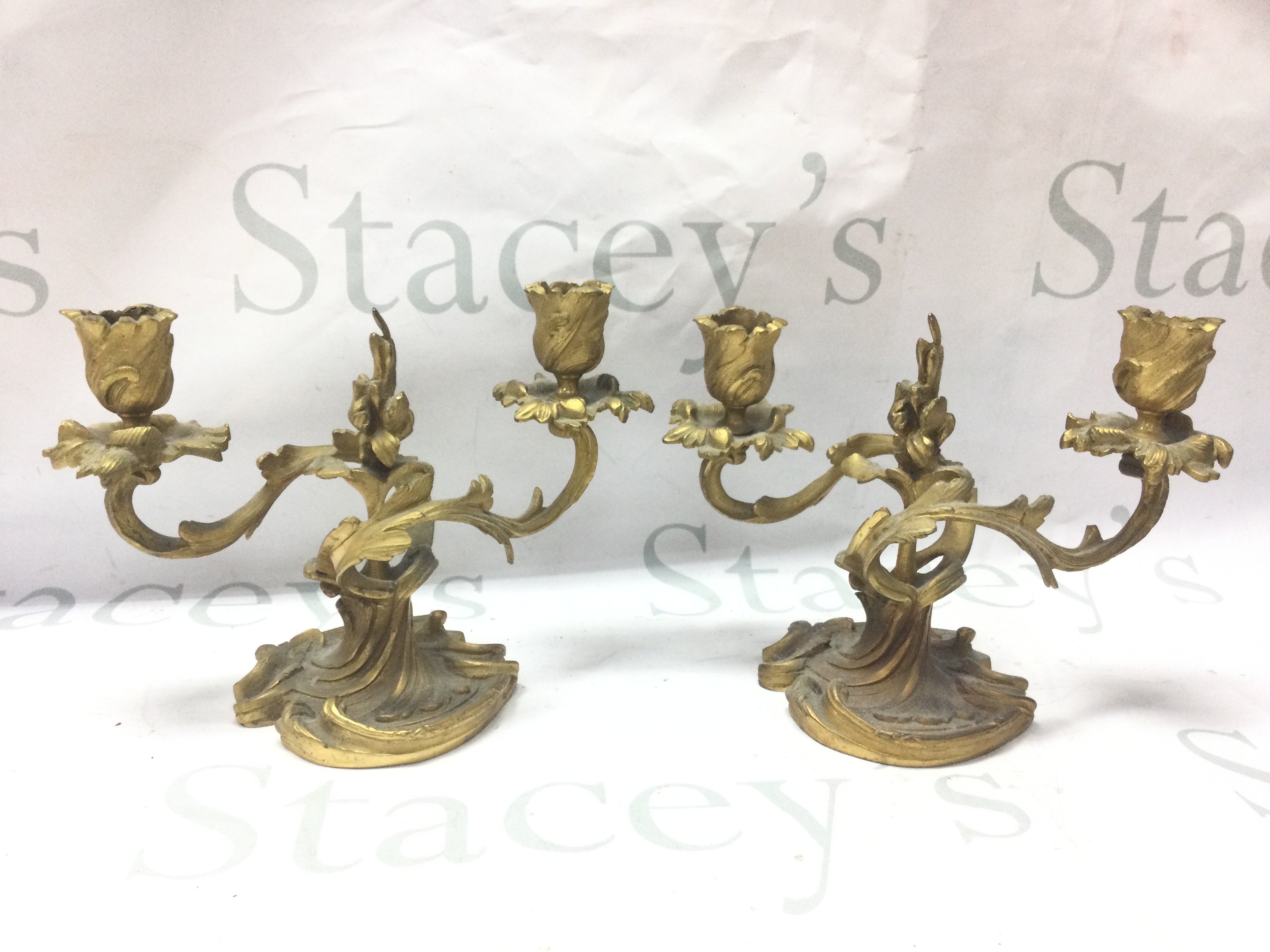 A pair of French ormoulo candelabras, approximately 15cm tall. 21cm wide. Postage category c