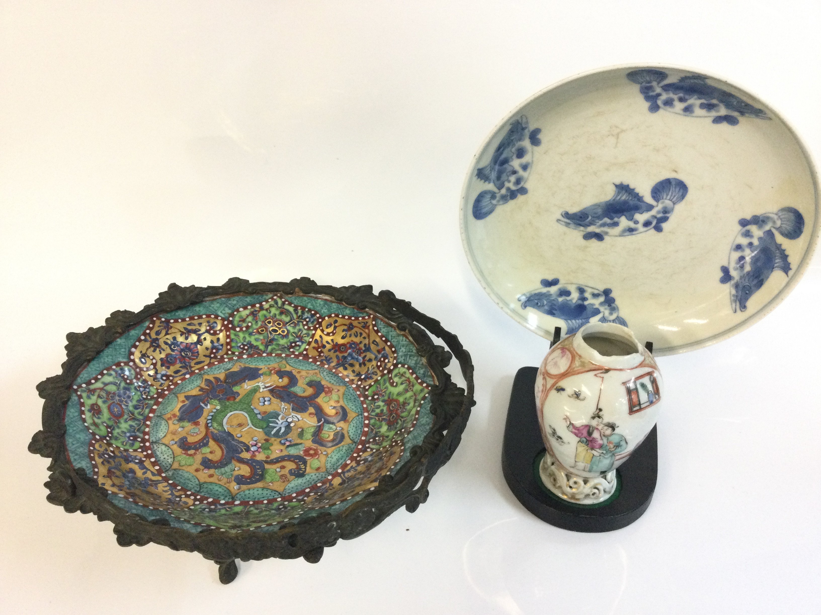 A Chinese blue and white fish plate with a six character mark at the base, 20cm wide. Cloisonne dish with metal stand, Famille rose vase. This lot cannot be posted