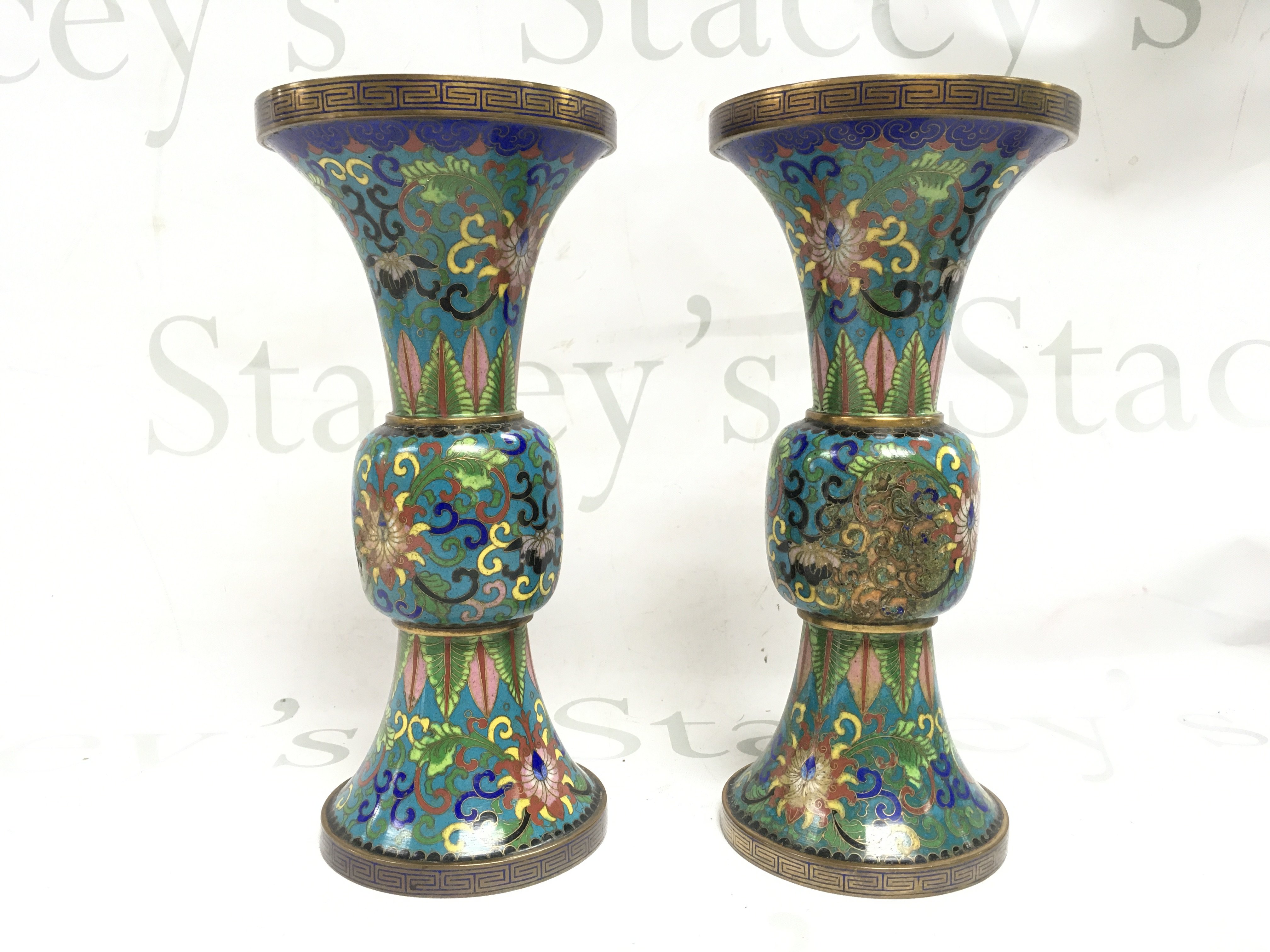 Two Chinese bronze cloisonne vases, 22cm high. Some damage . Postage category B