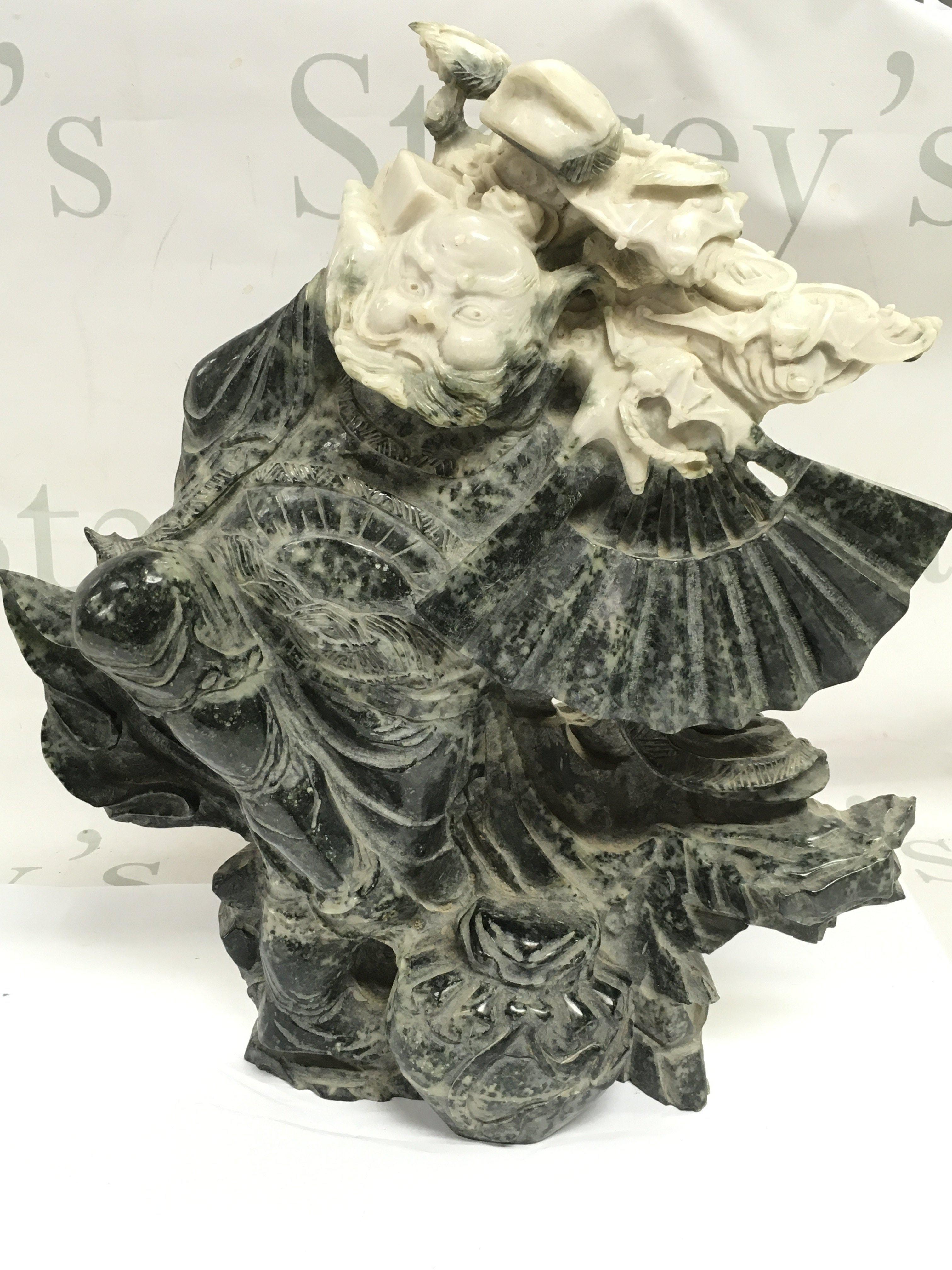 A Large Jade Guardian figure ,34 cm tall 28cm wide. This lot cannot be posted