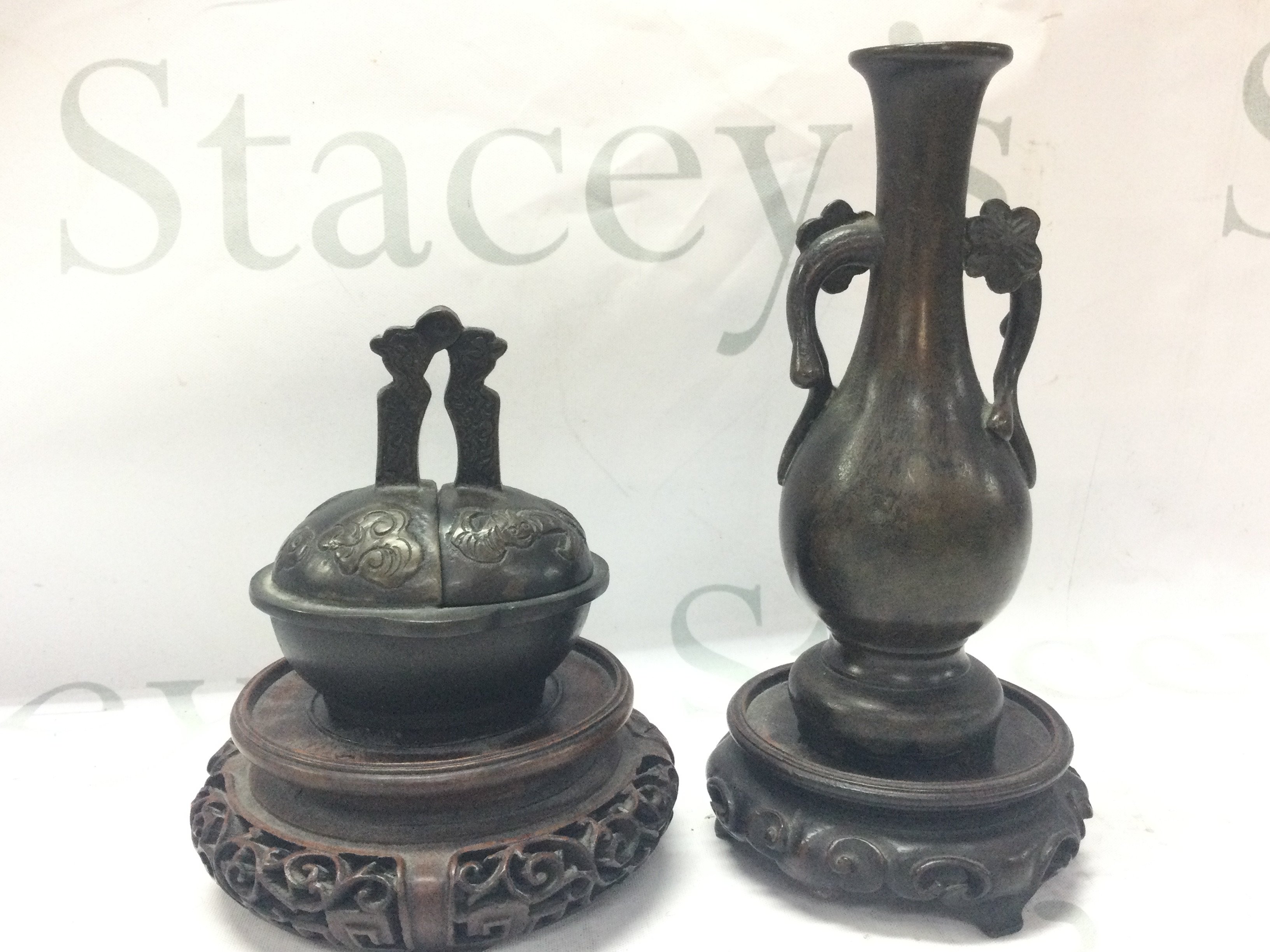 An unusual Bronze Chinese foldable candlestick with a six character mark to base and a bronze Japanese flower vase . 9 and 15cm tall. Postage category B