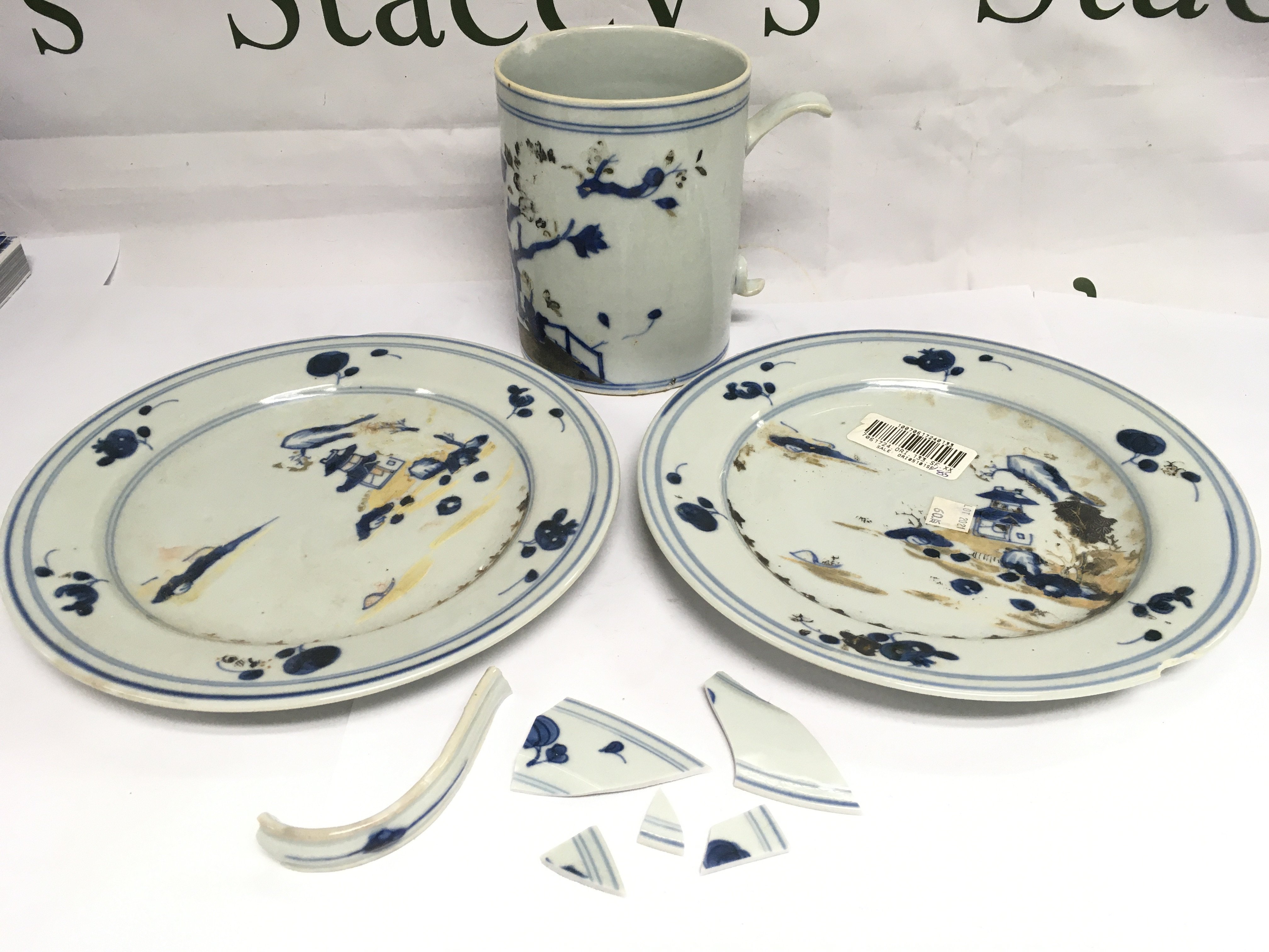 Three Tek Sing blue and white items comprising two plates and a tankard (a/f). Shipping category D.