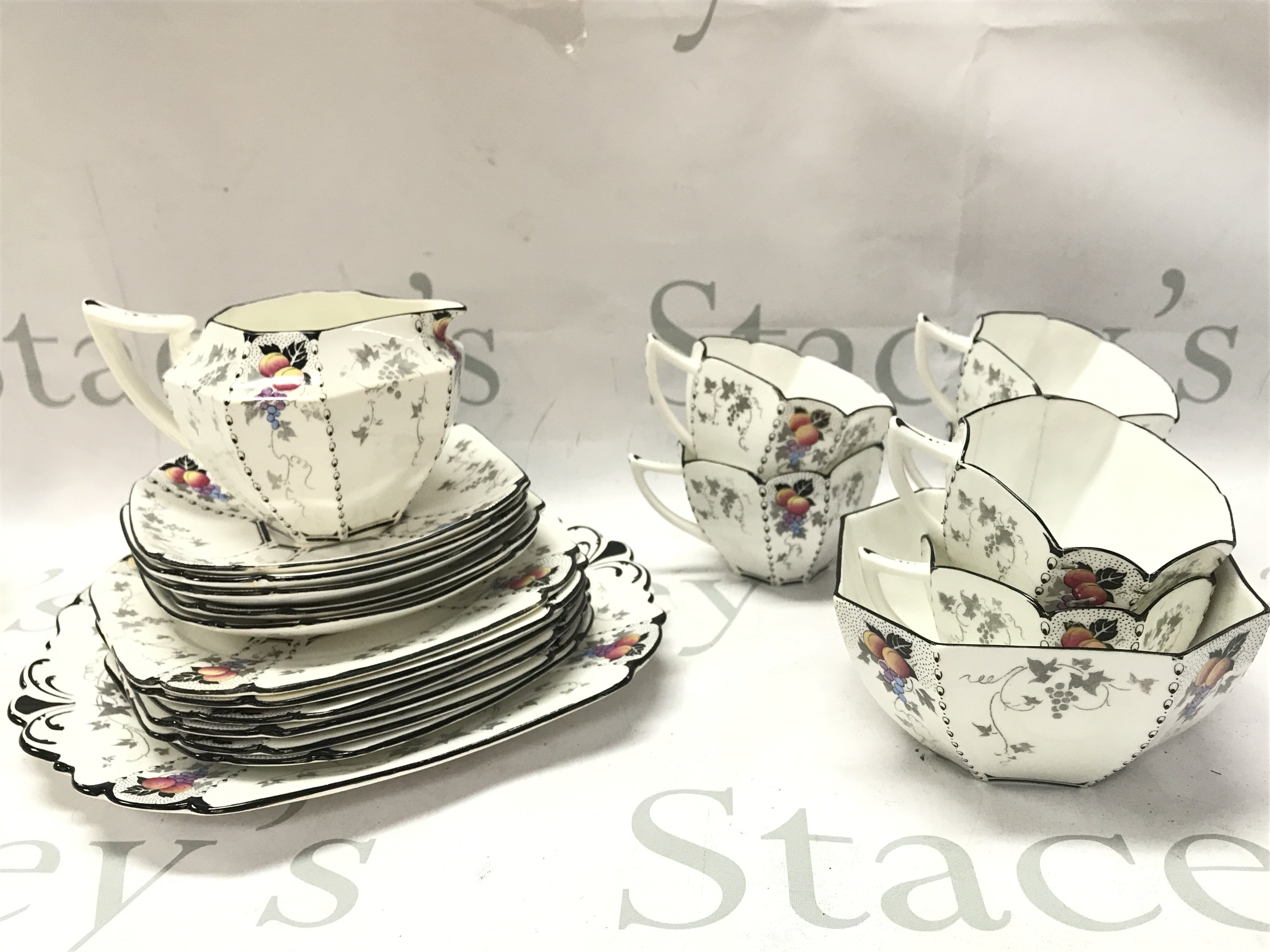 Shelley art deco Queen Anne Peaches and Grapes pattern tea set including saucers and cups. This lot cannot be posted
