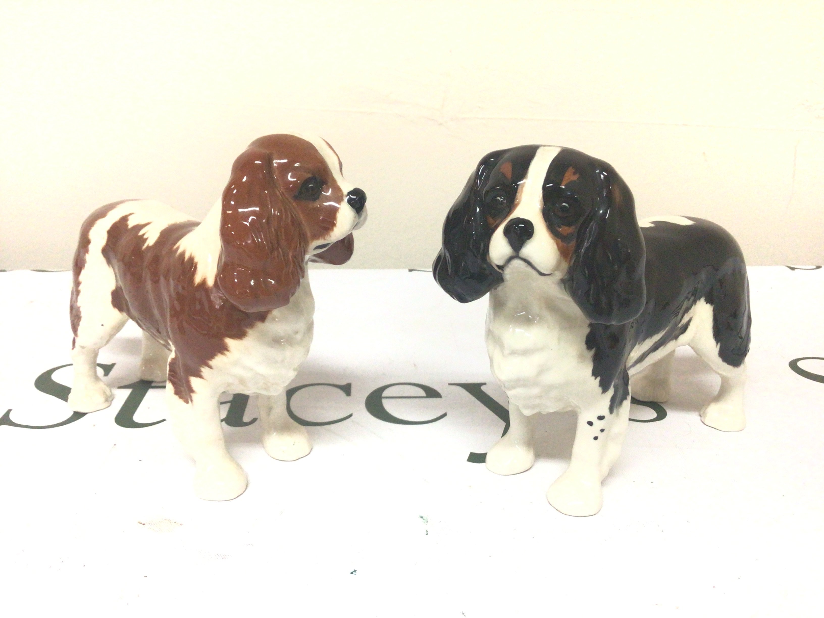Two Beswick King Charles dog ornaments no obvious damage. (2)