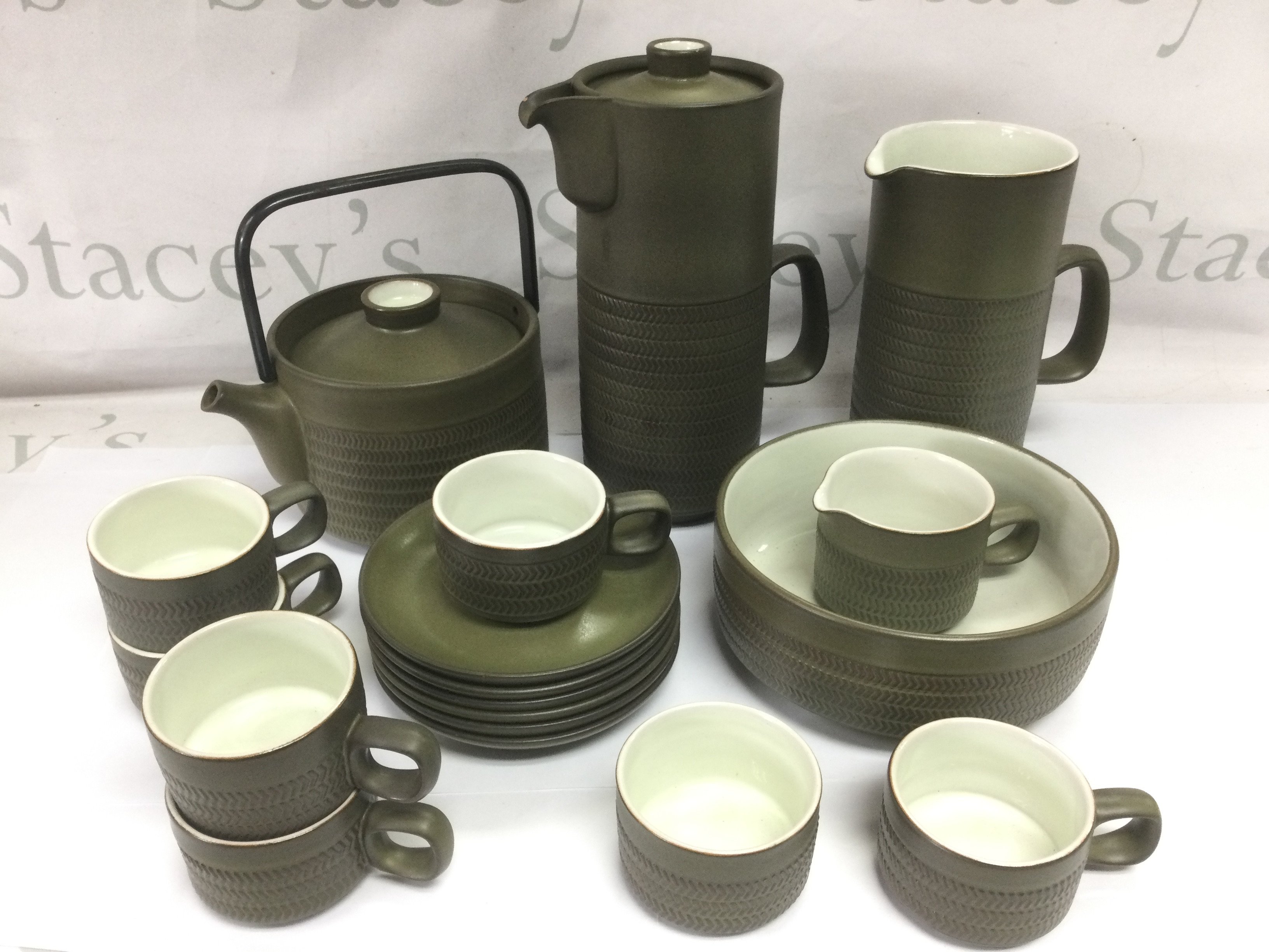 A Denby stoneware tea and coffee service. Shipping category D.