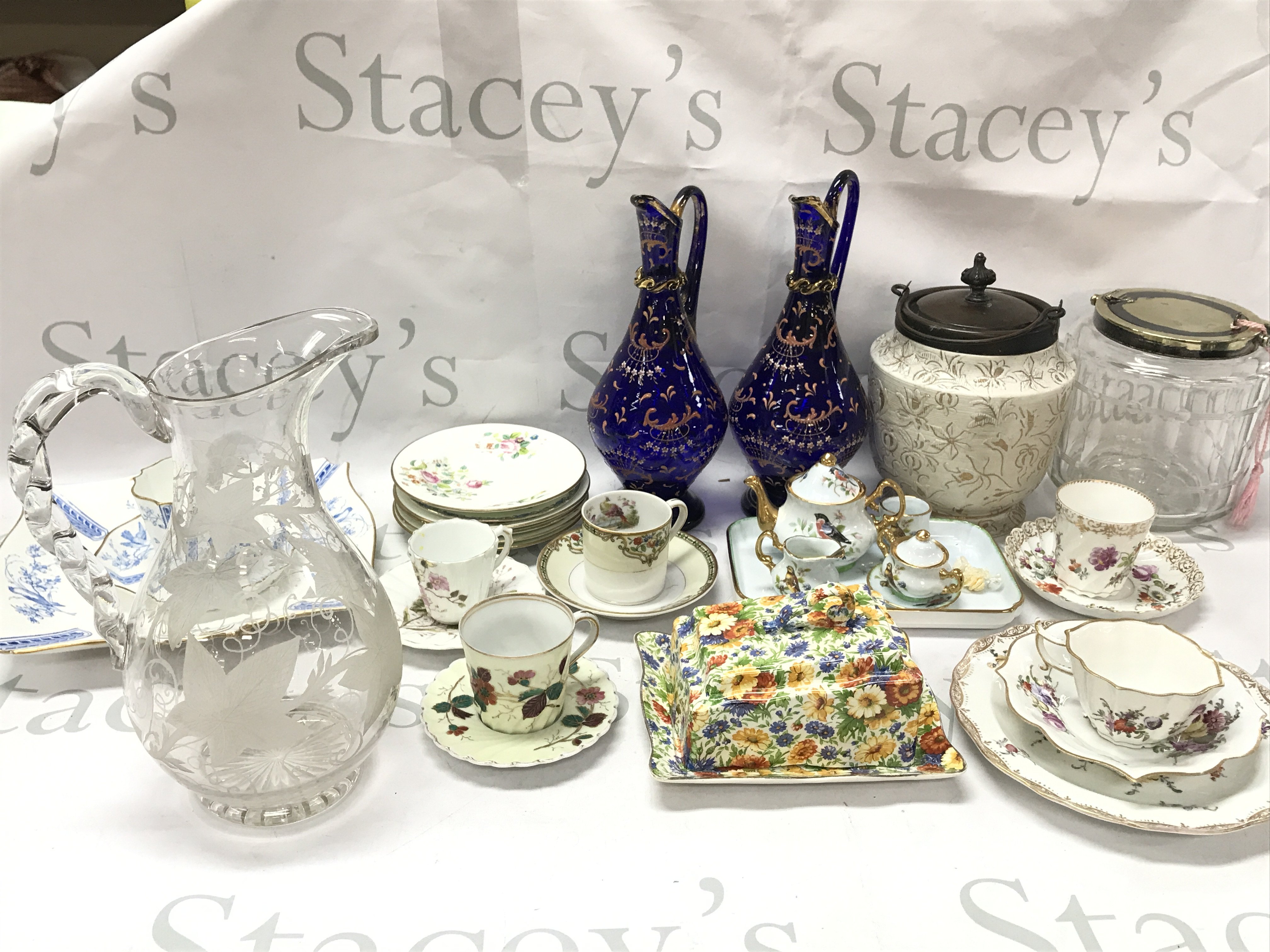 A collection of ceramics including Meissen second condition plate, cup and saucer, 19th century Wedgewood plate , cup and saucer, Damask biscuit barrel , blue glass Victorian enamel decorated jugs, James Kent marigold. This lot cannot be posted.