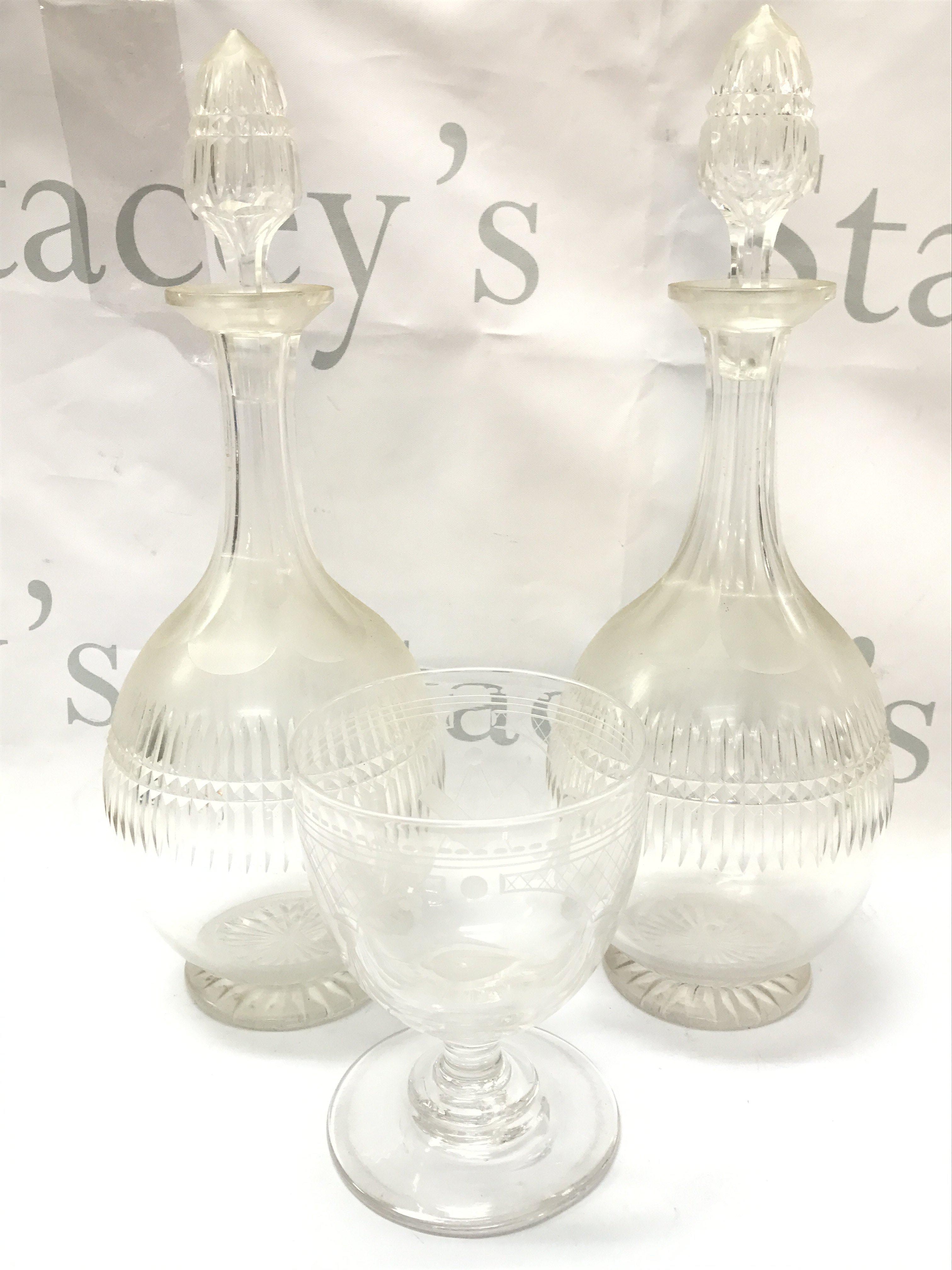 a Victorian masonic wheel etched goblet and a pair of decanters , chip on rim of goblet . This lot cannot be posted
