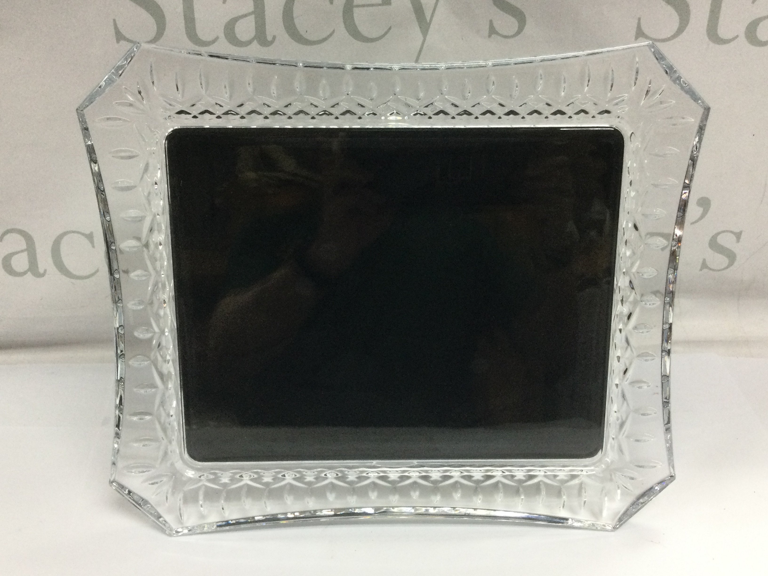 A large Waterford crystal photograph frame, approx 34cm x 29cm. Shipping category D.