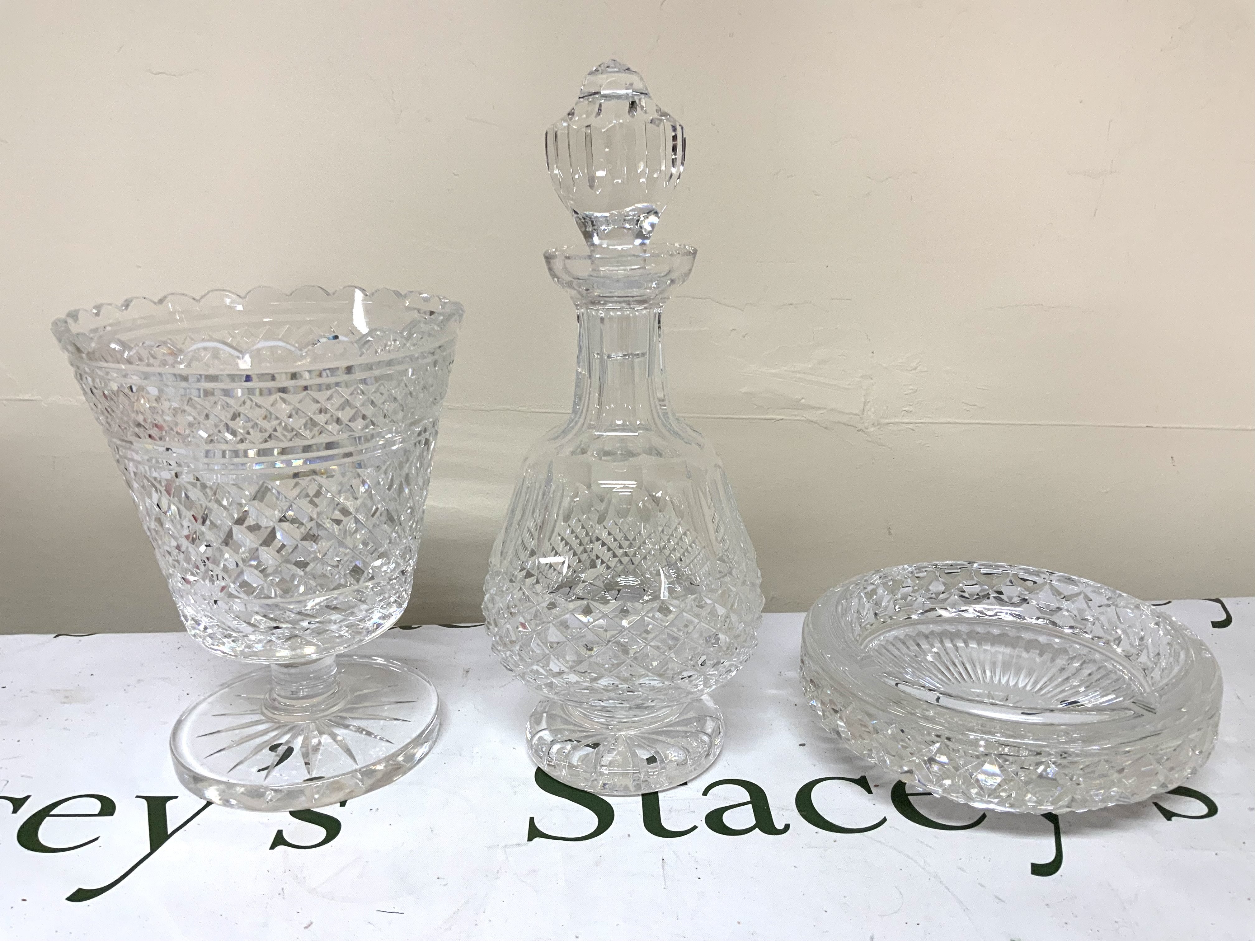 A Waterford cut crystal celery vase, 20cm, Waterford Crystal decanter 30cm, Waterford crystal ashtray 18cm