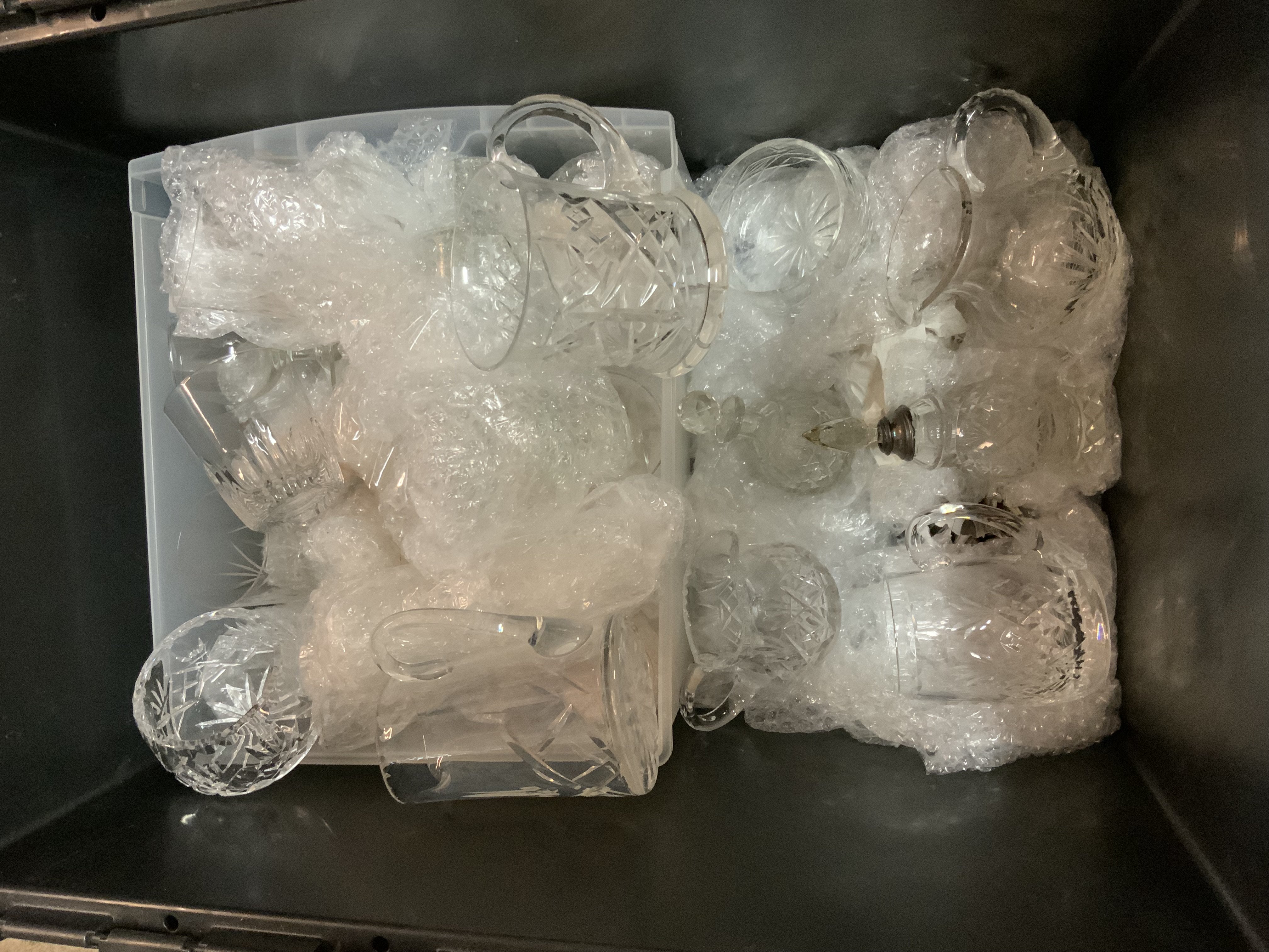 A large collection of cut glass and crystal. Decanters and glassware.