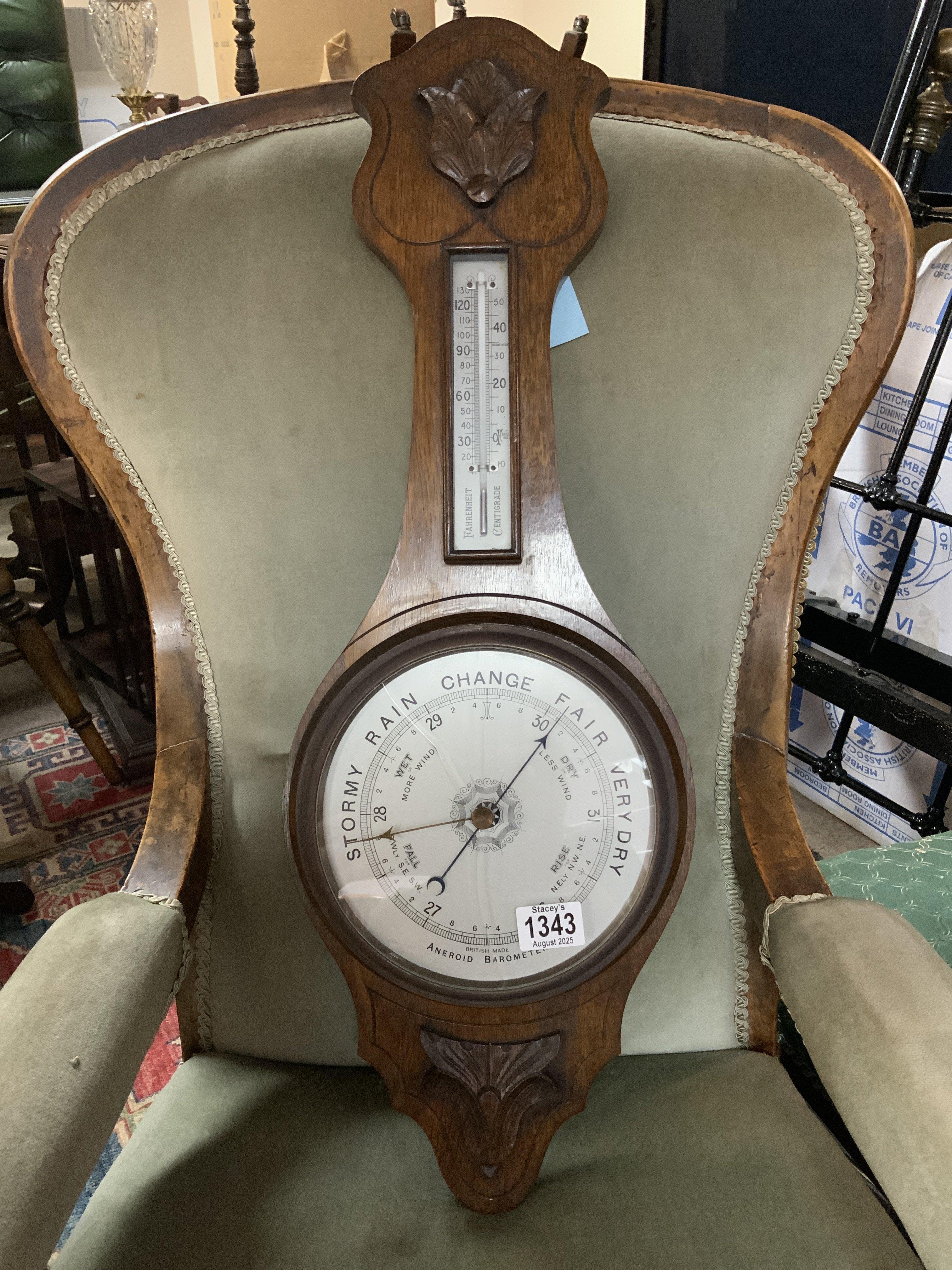 A 1930s Oak Aneroid barometer. 75cm.