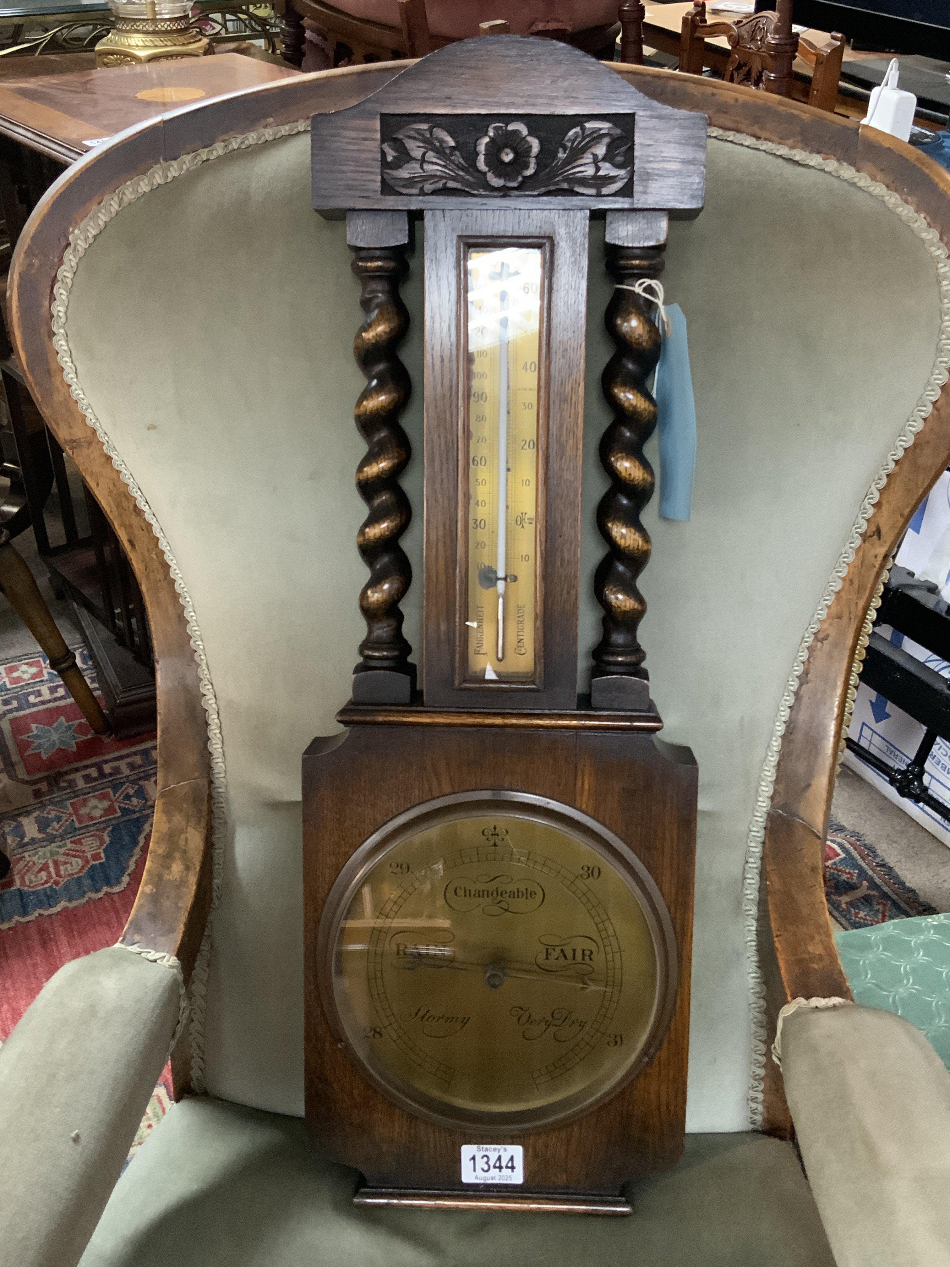 A Holland of London, brass dial oak barometer. 70cm.