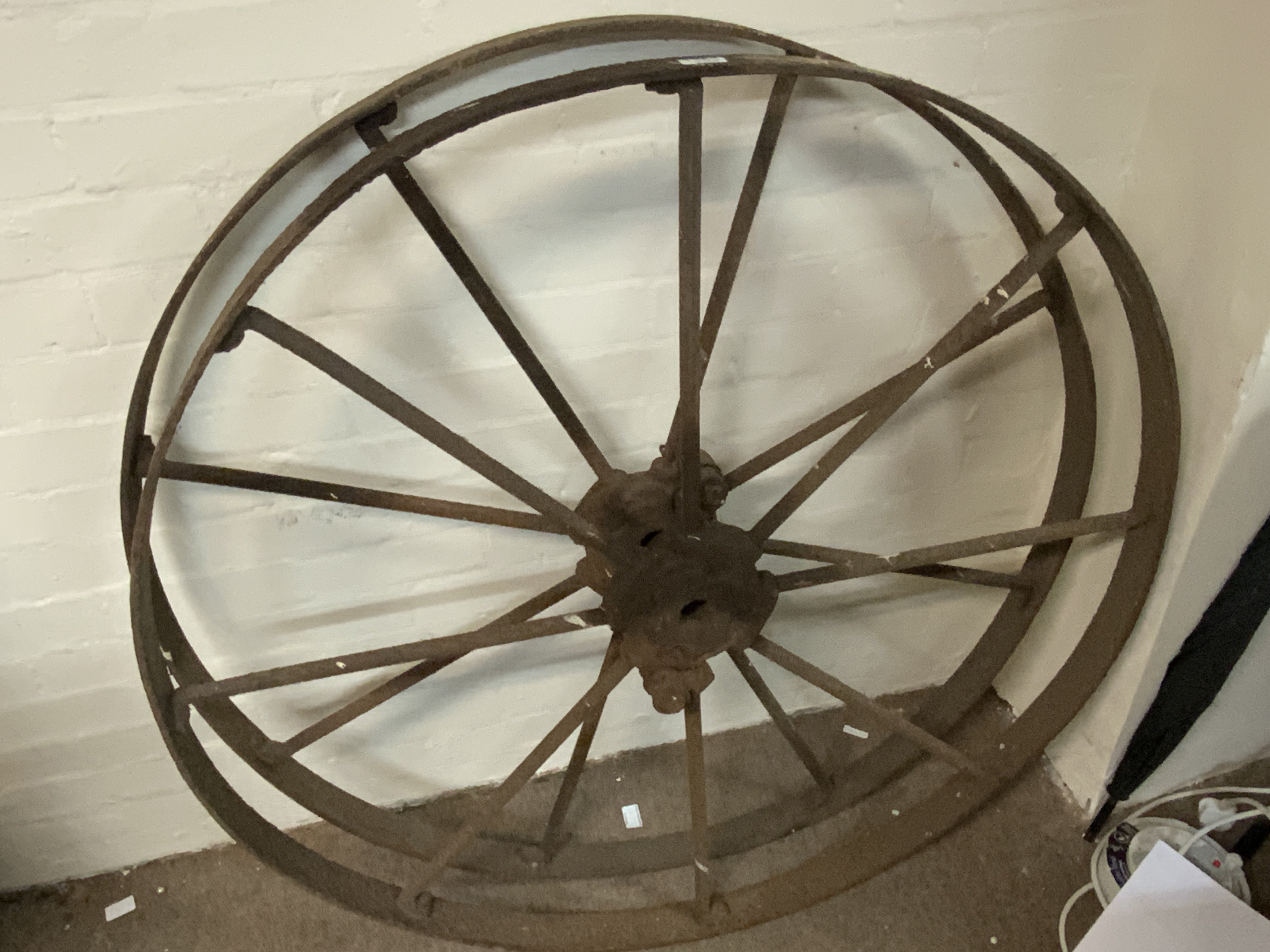 A large pair of cast iron wheels. 112cm diameter.