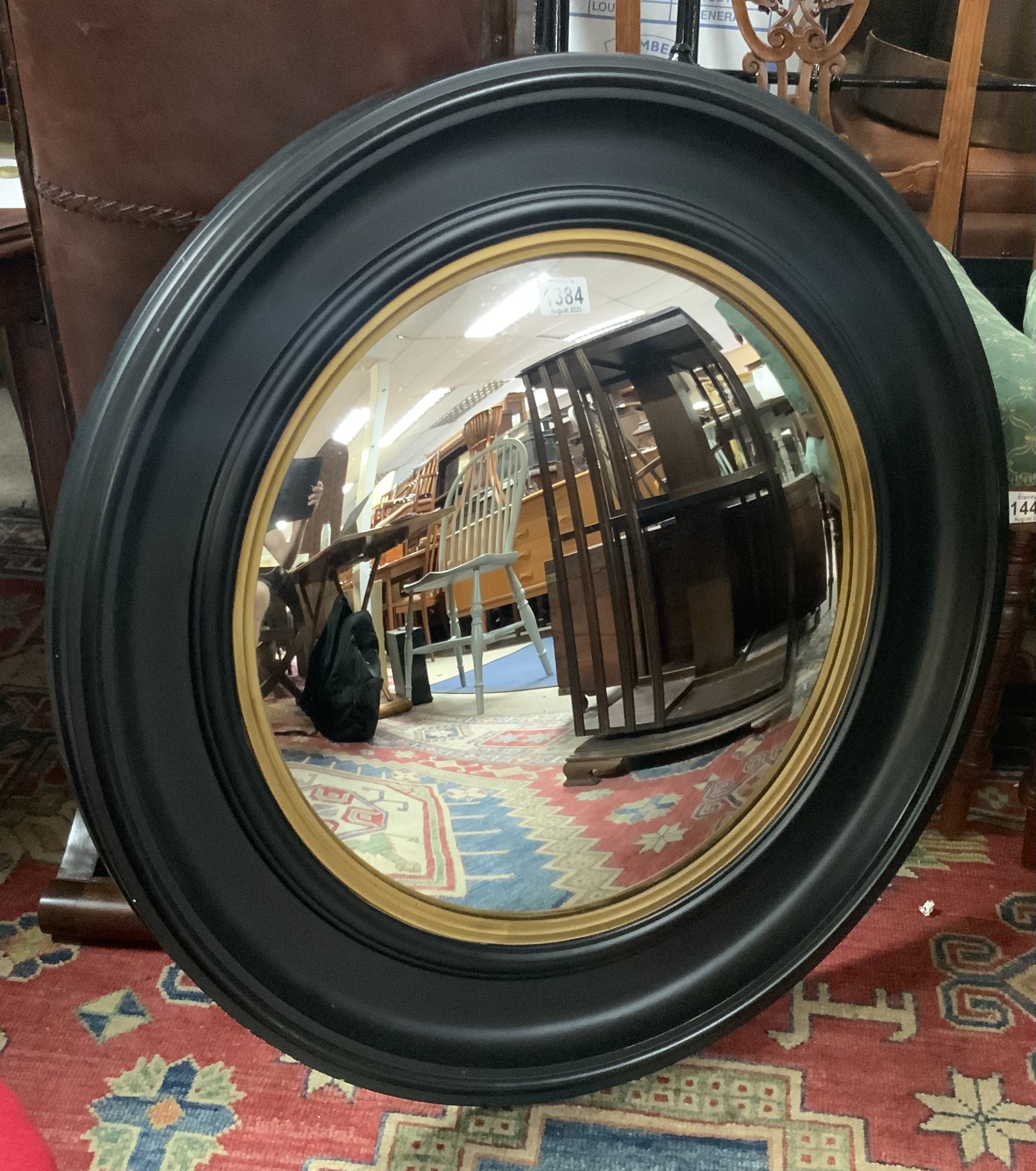 A large convex circular wall mirror, 74cm.