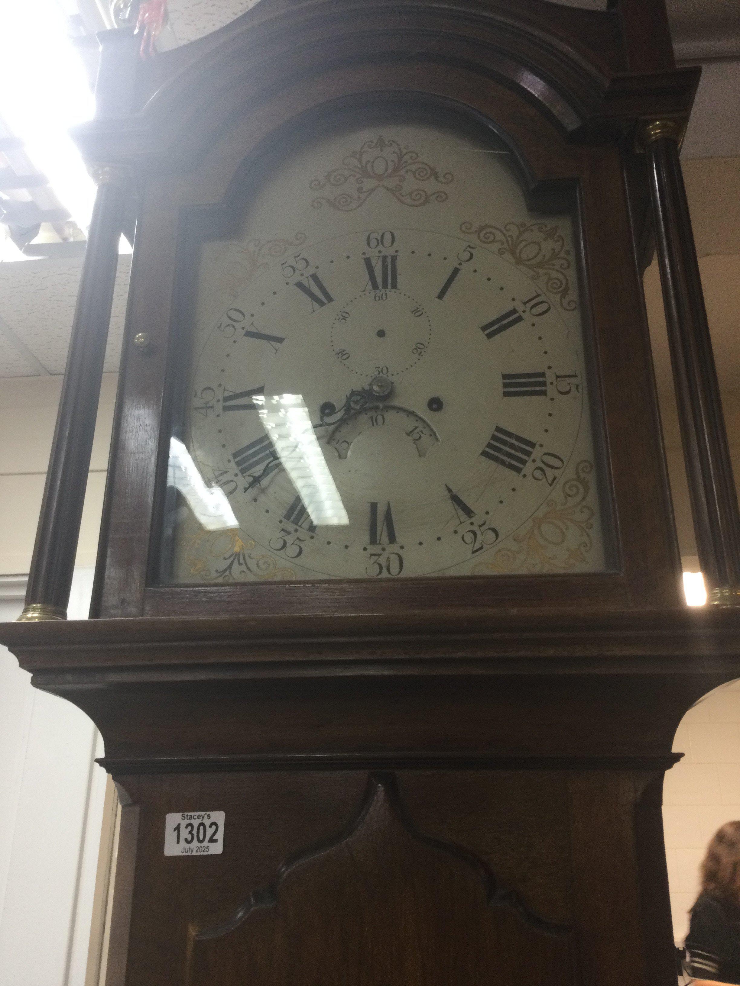 A mahogany long case the painted dial with Roman numerals.- NO RESERVE