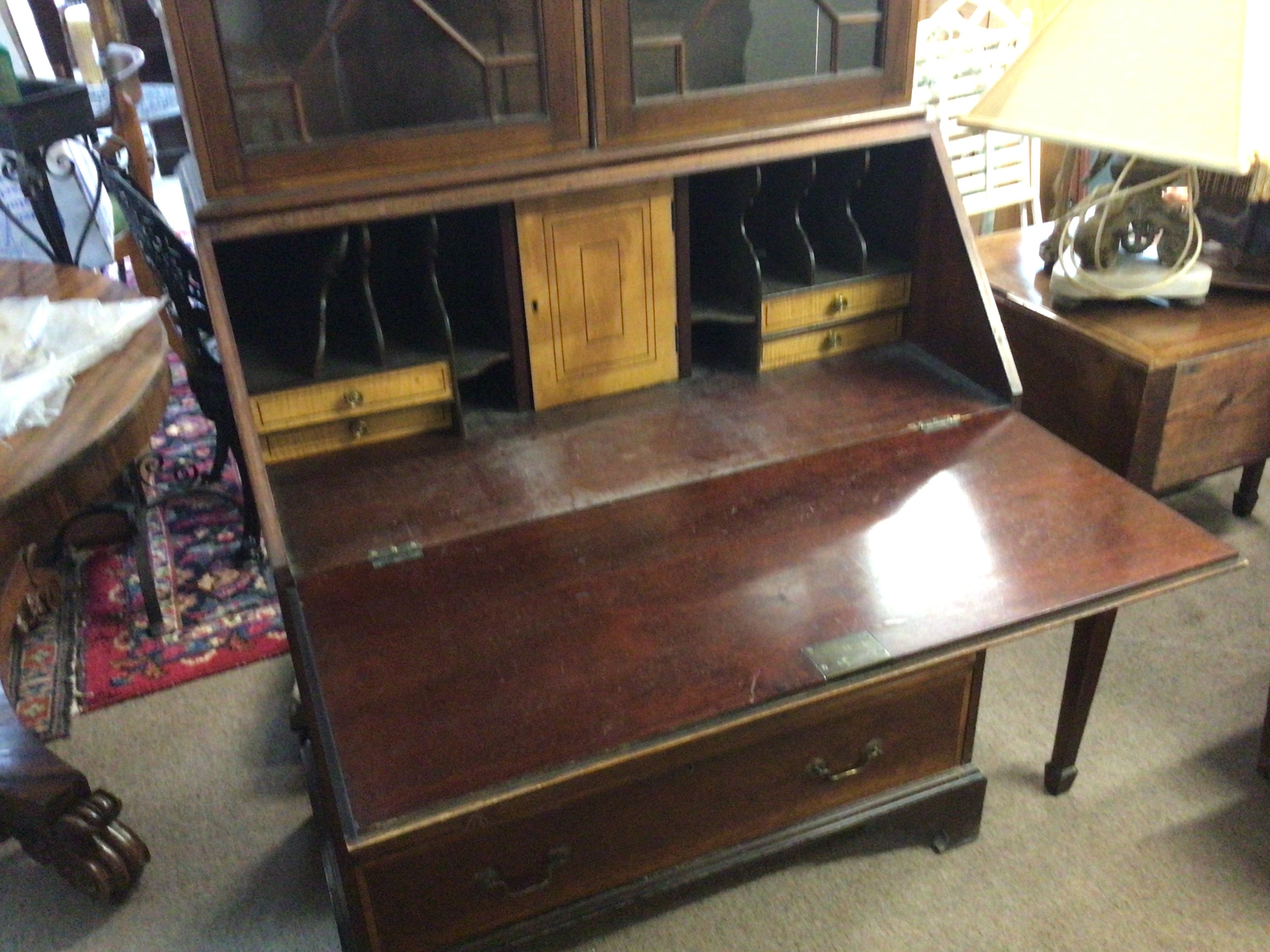An Edwardian mahogany and satinwood banded bureau bookcase with a shaped pediment above a fall front and four graduating drawers. NO RESERVE