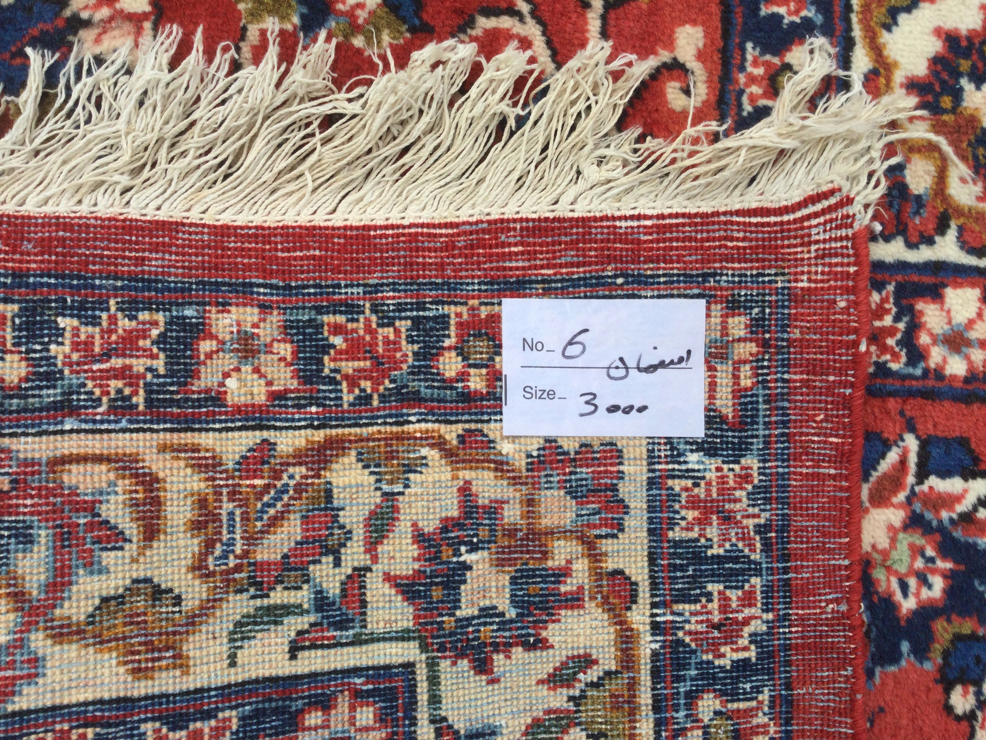 A large Persian rug, approx 3.2metres x 4.1metres. Shipping category D.