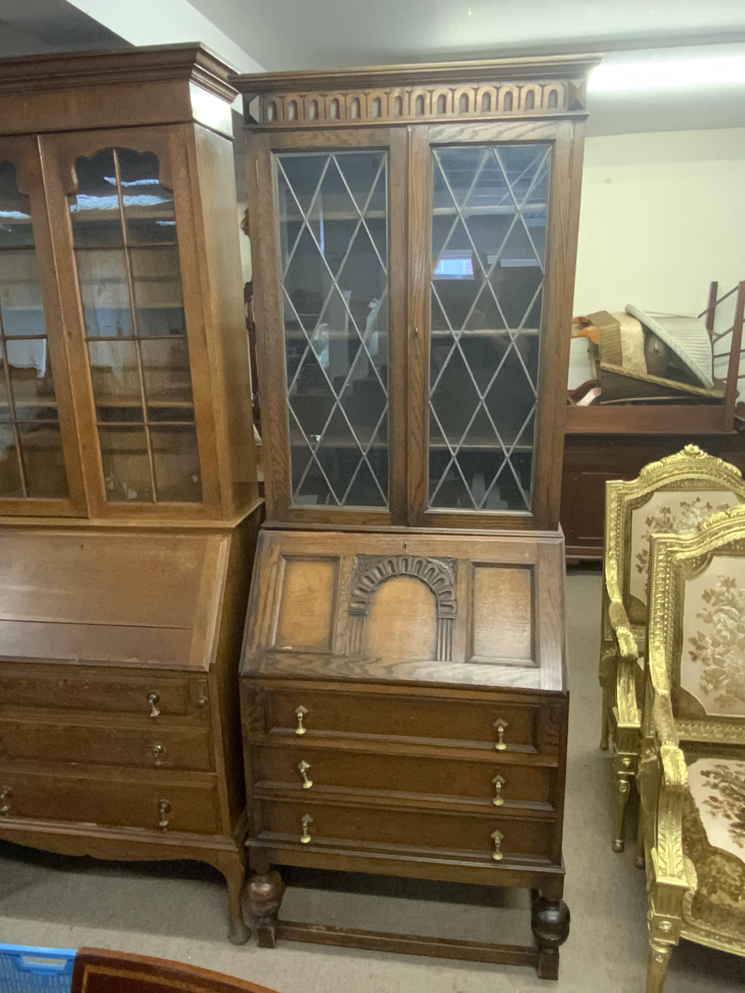 An oak bureau bookcase with lead glazed doors. 202cm x 73cm