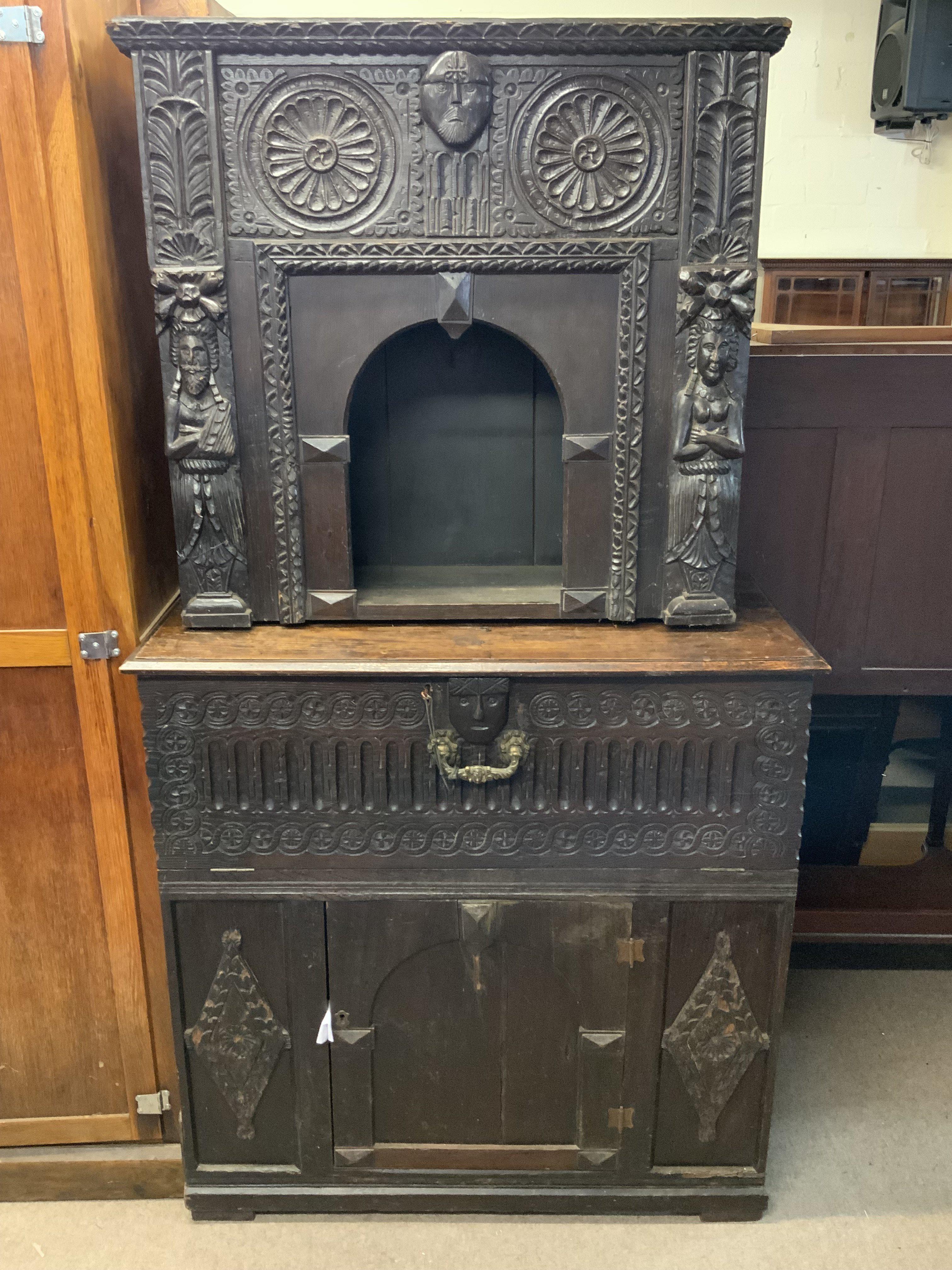An antique gothic carved oak court style cabinet profusely carved front and side.175cm x 93cm.