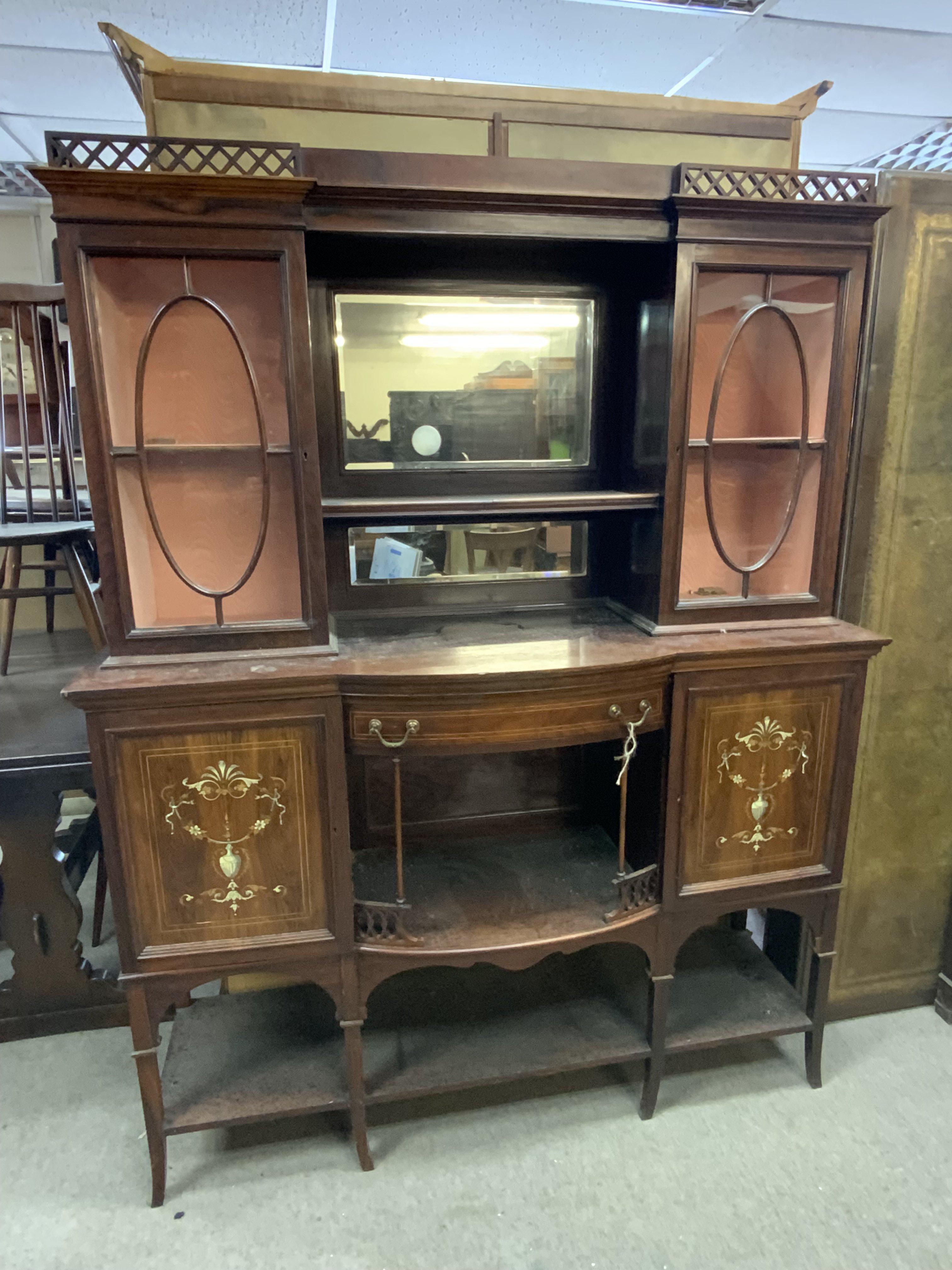 An Edwardian rosewood veneered sideboard with inlaid decoration.
