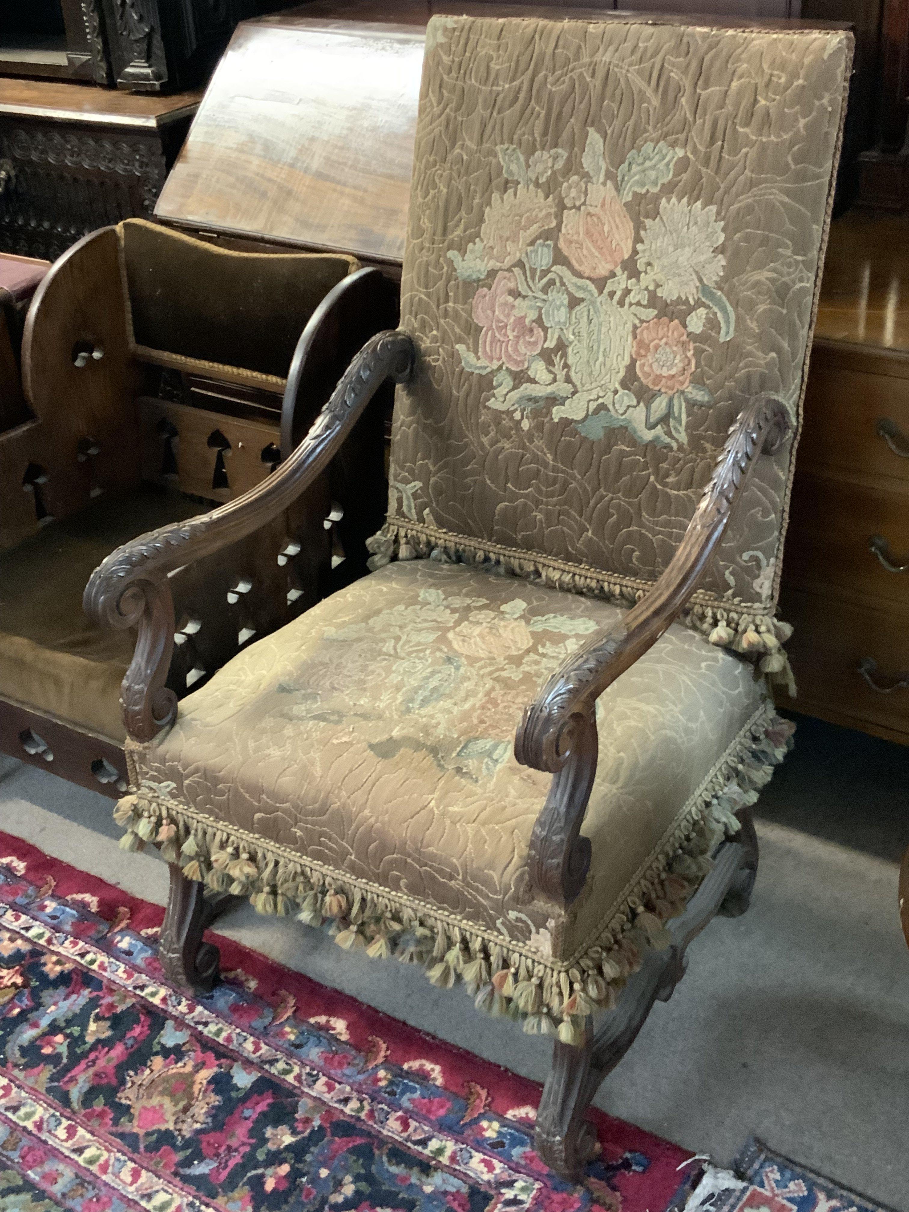 A French upholstered open armchair. 63cm x 116cm.