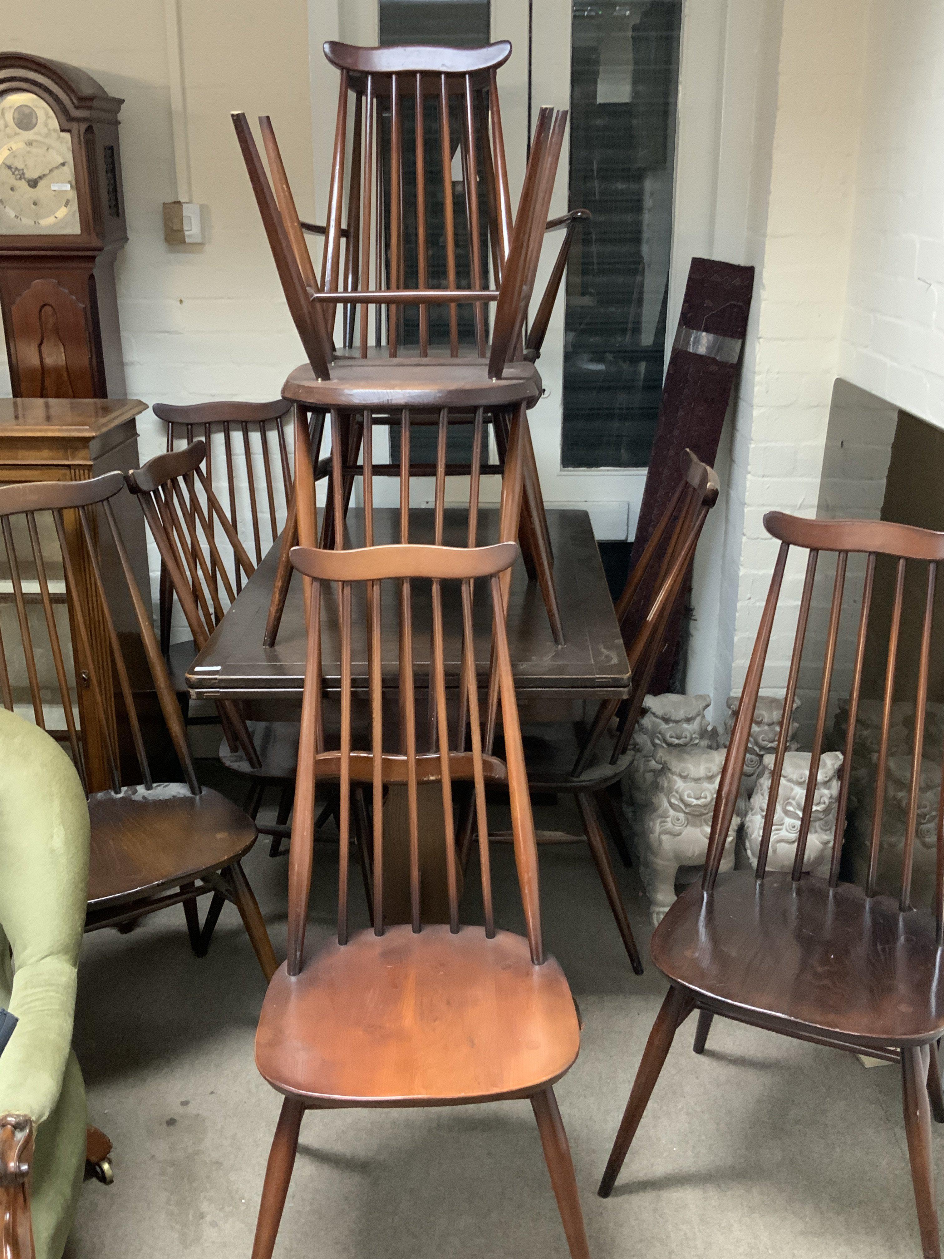 10 Ercole stick back dining chairs together with a small draw leaf table.