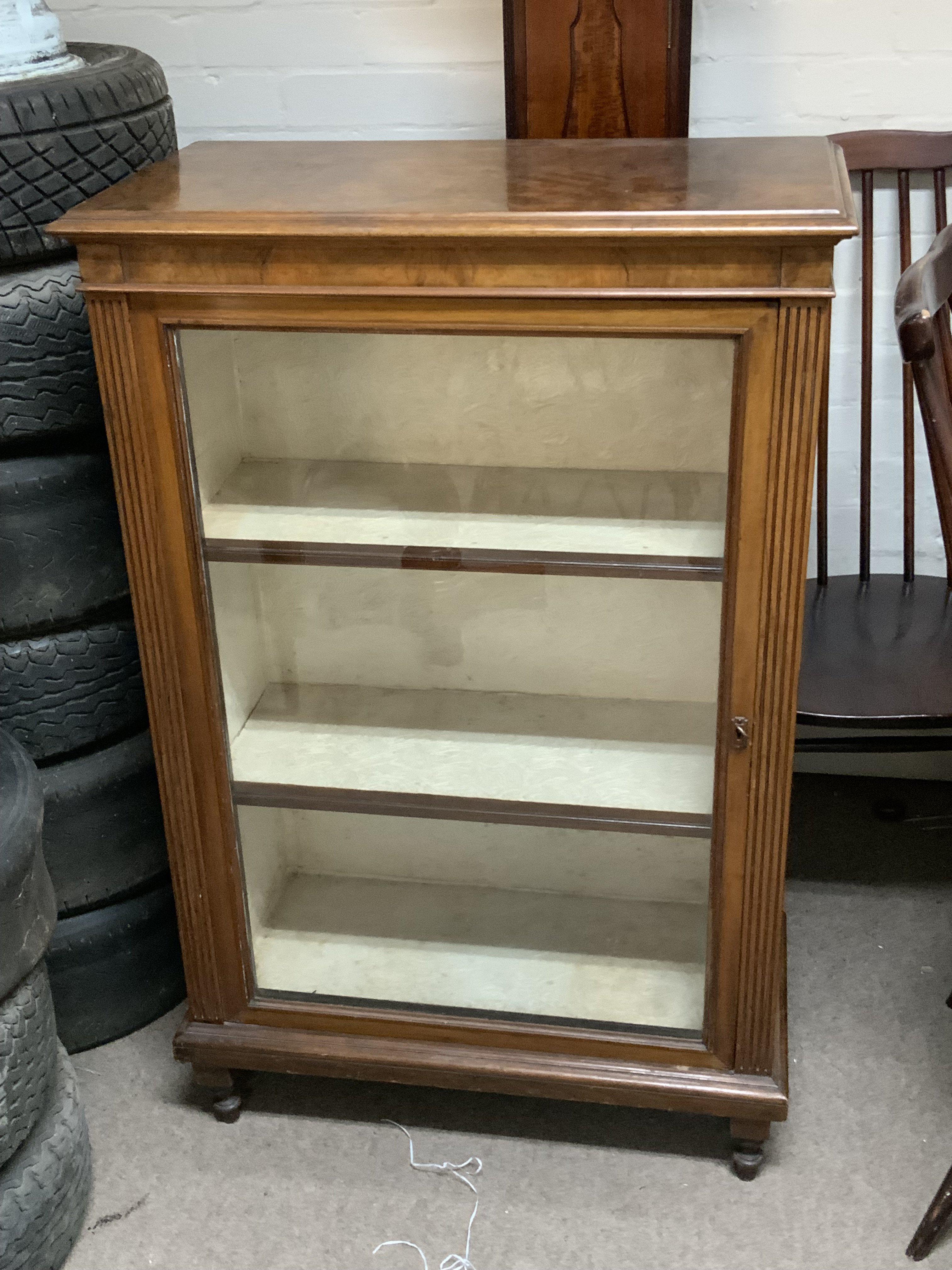 A Victorian walnut glazed pier cabinet.69cm x 106cm x 36.5cm