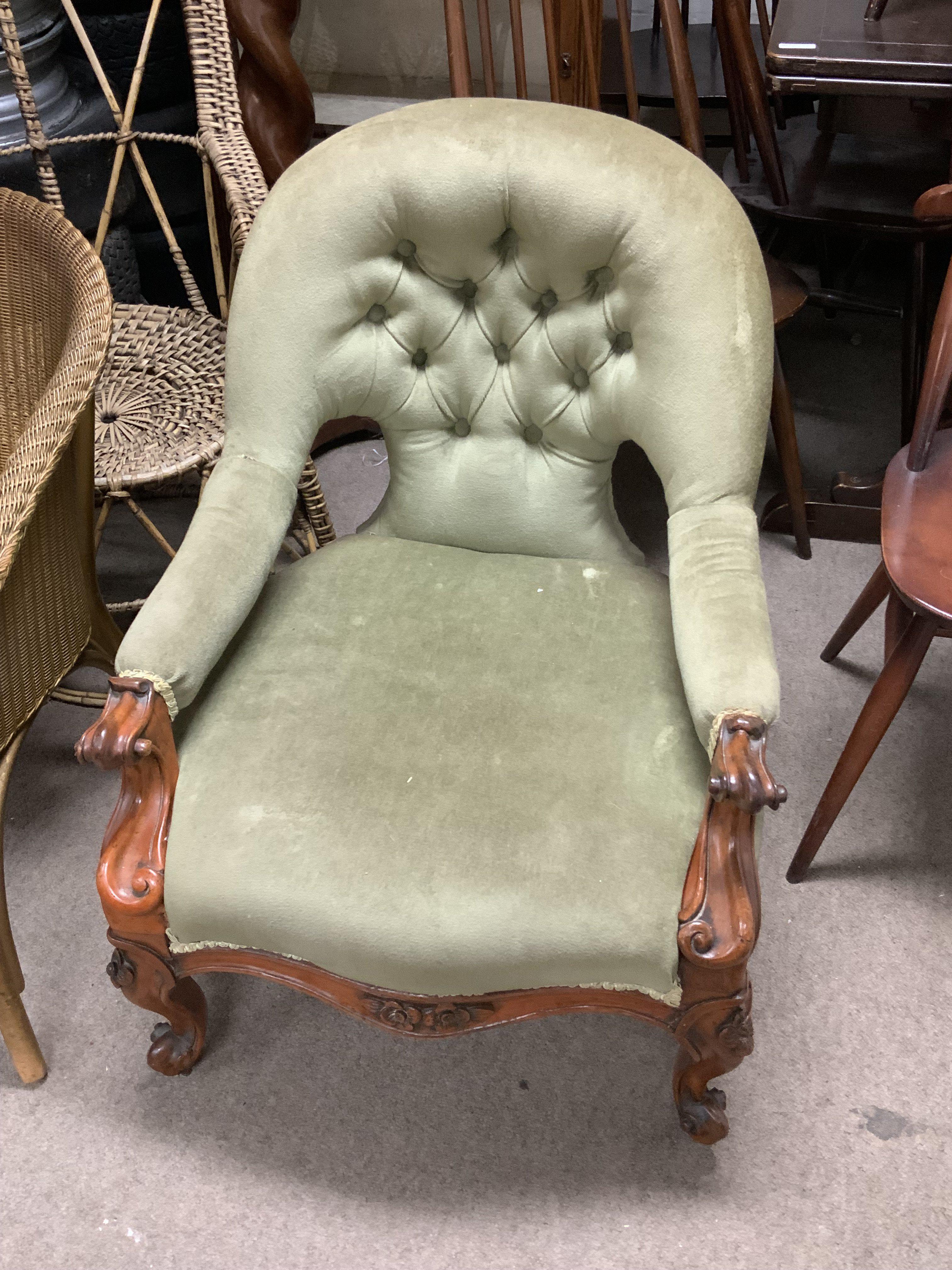 A small Victorian walnut upholstered nursing chair.