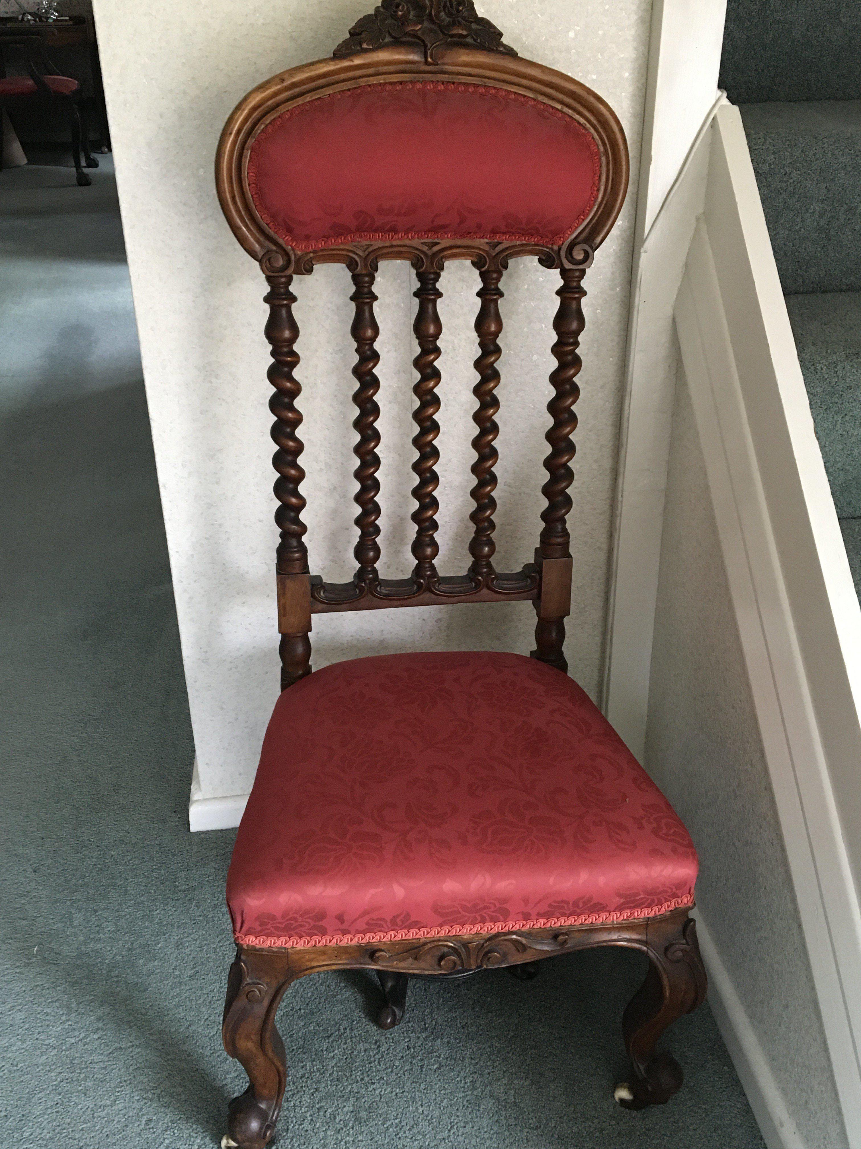 A Victorian carved walnut occasional chair the arched top rail above spirally turnings and conforming uprights.with an upholstered seat and back. NO RESERVE
