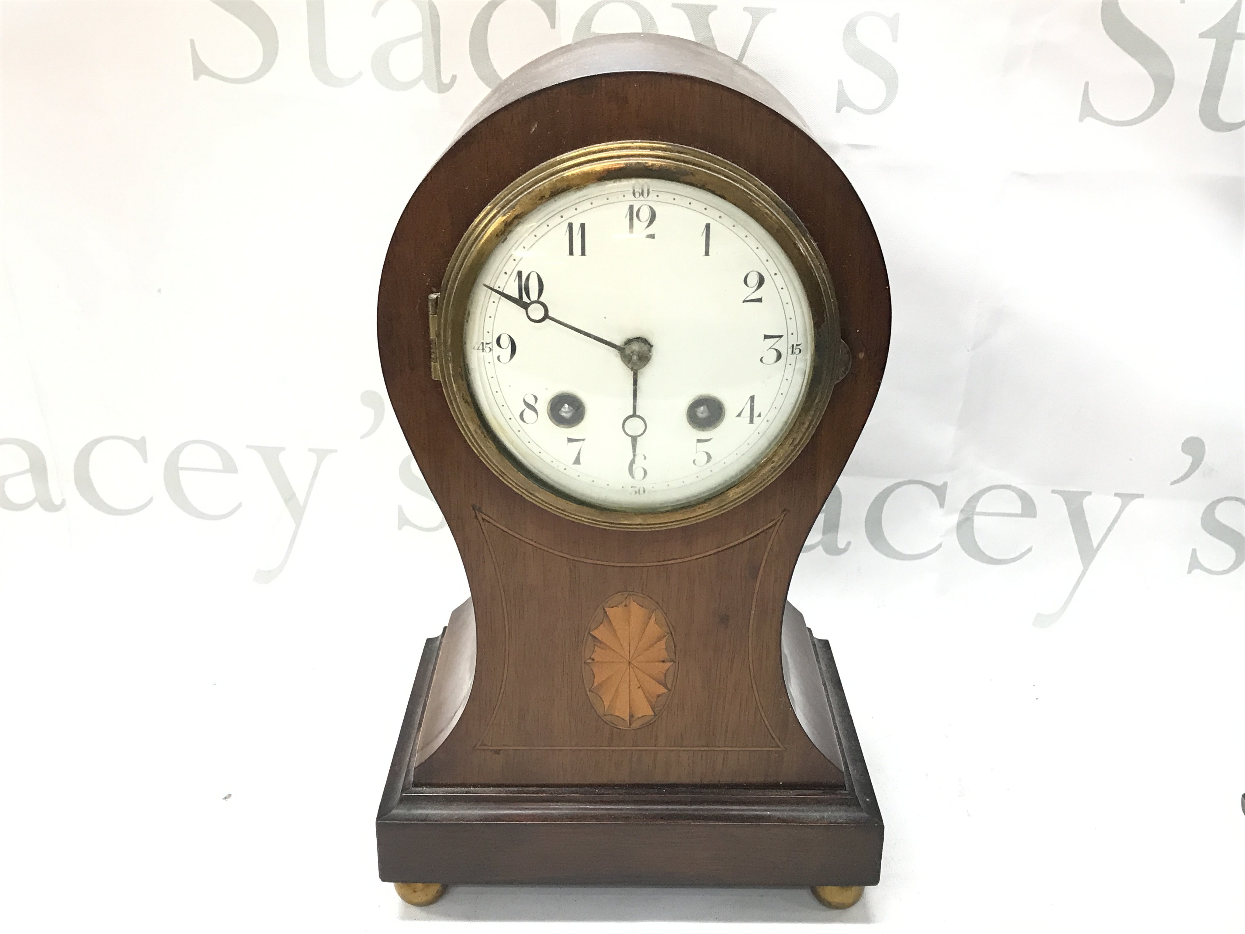 A mantle clock with inlaid design and French movement , this lot cannot be posted