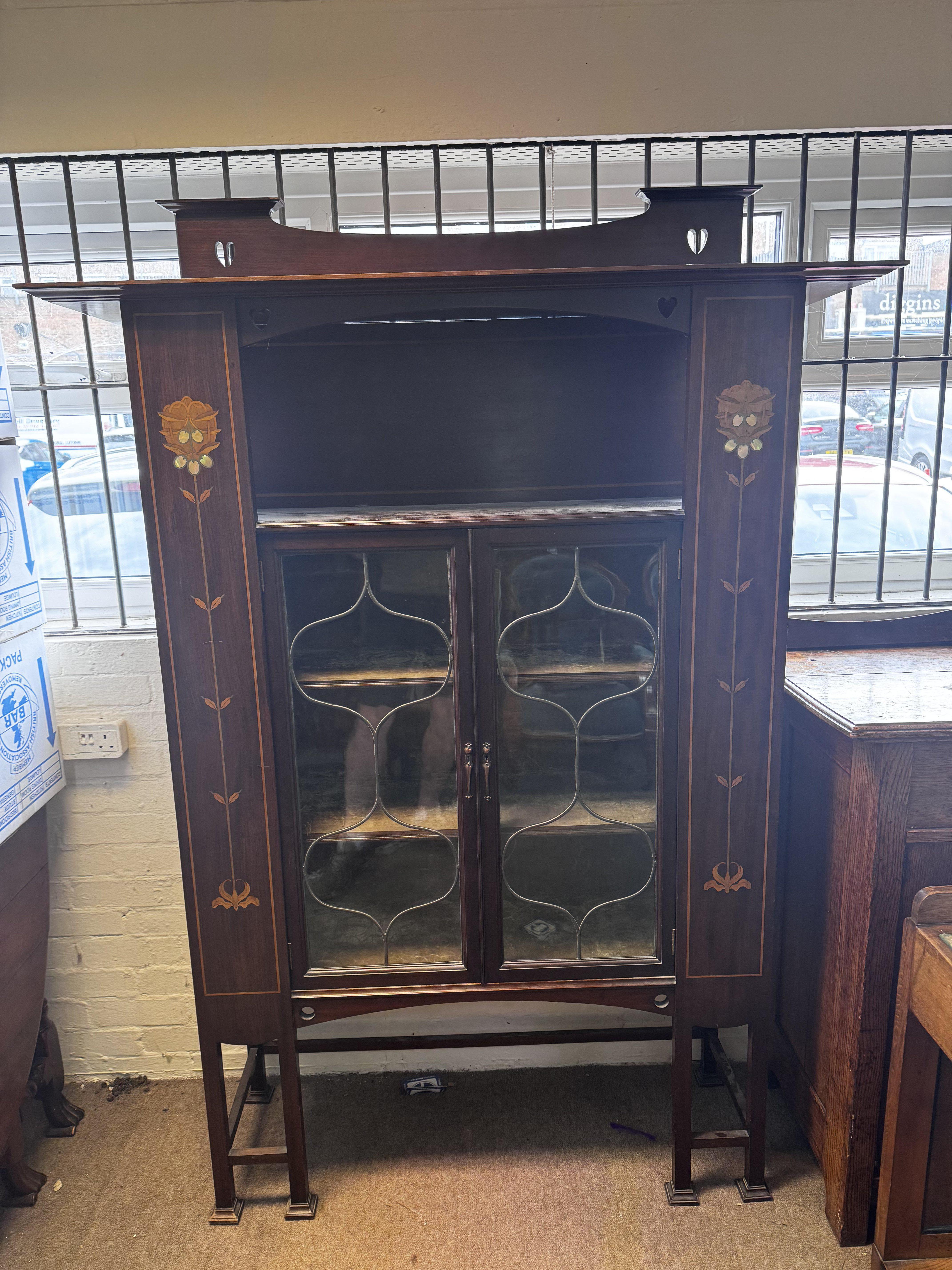 An Art Nouveau Display Cabinet, circa 1905 , 190cm x 135cm.
