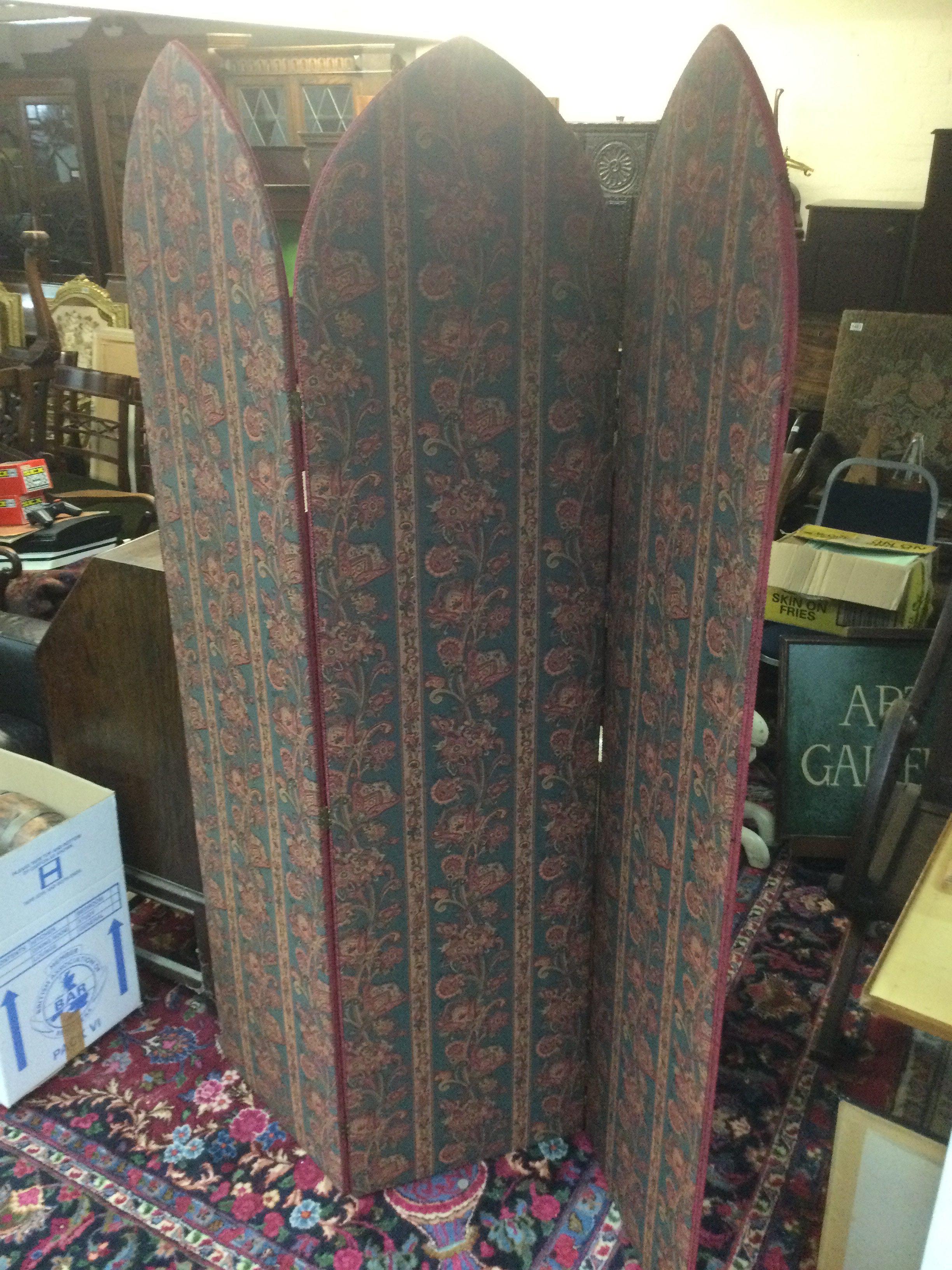 A folding screen upholstered with floral tapestry, approx height 184cm. Shipping category D.