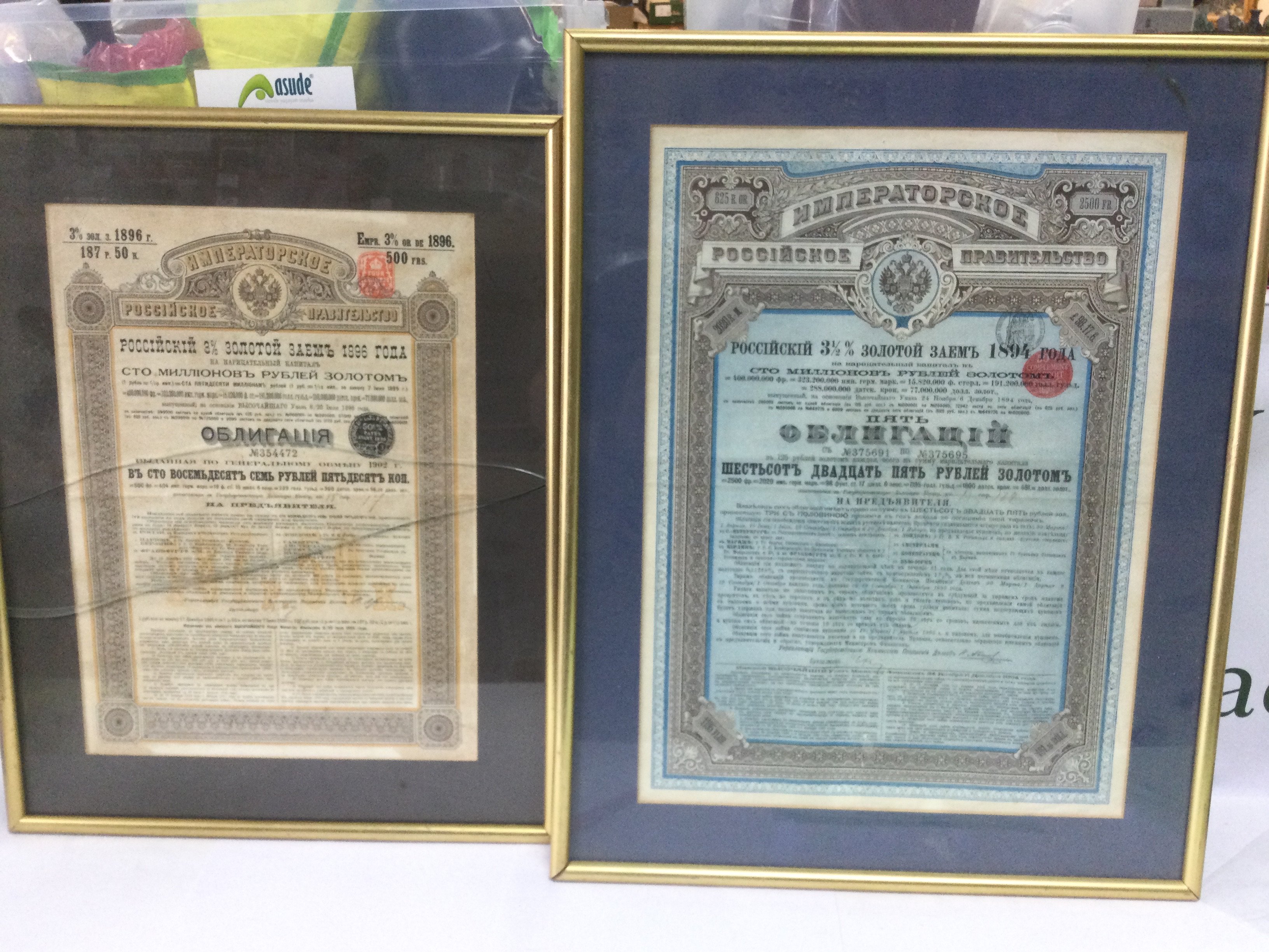 Six framed and glazed share certificates, one frame a/f. Shipping category D.- NO RESERVE