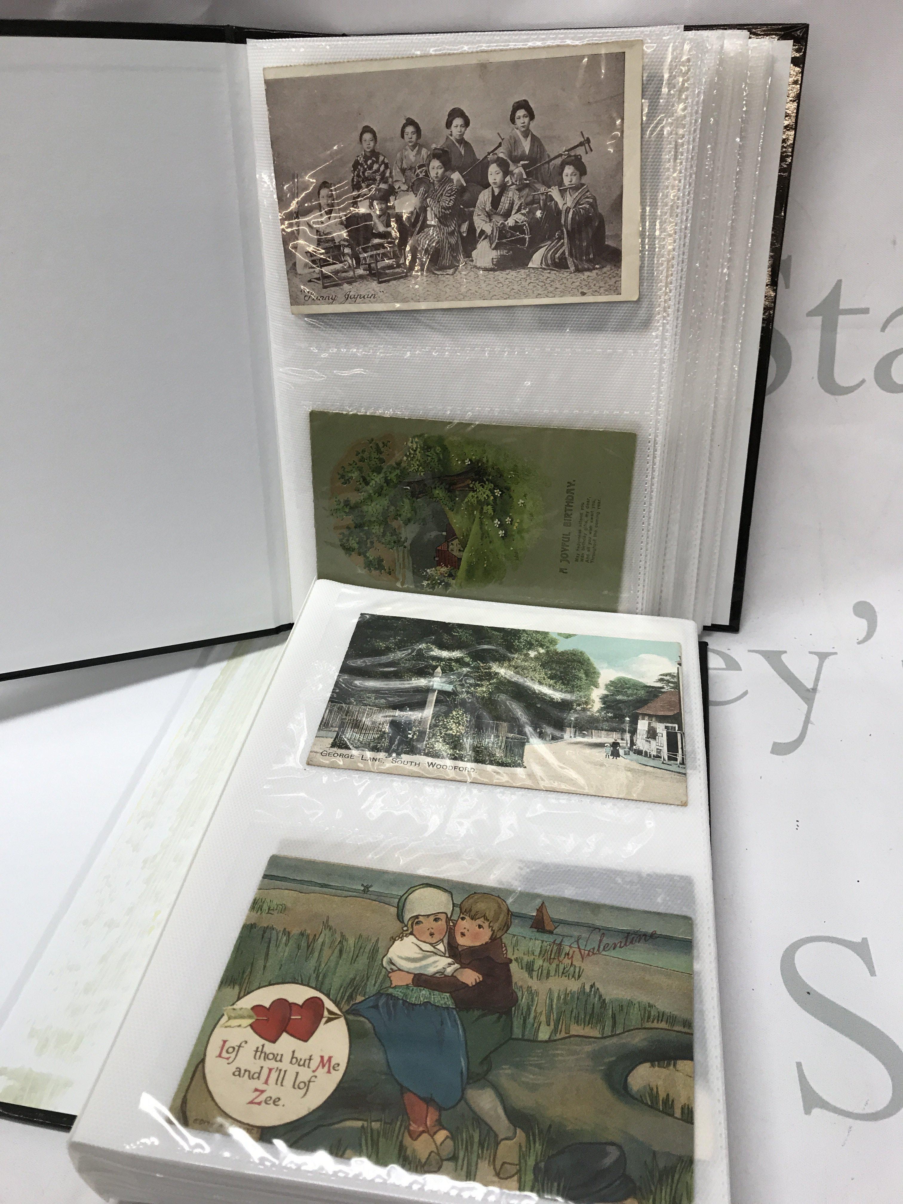 Two albums of vintage postcards