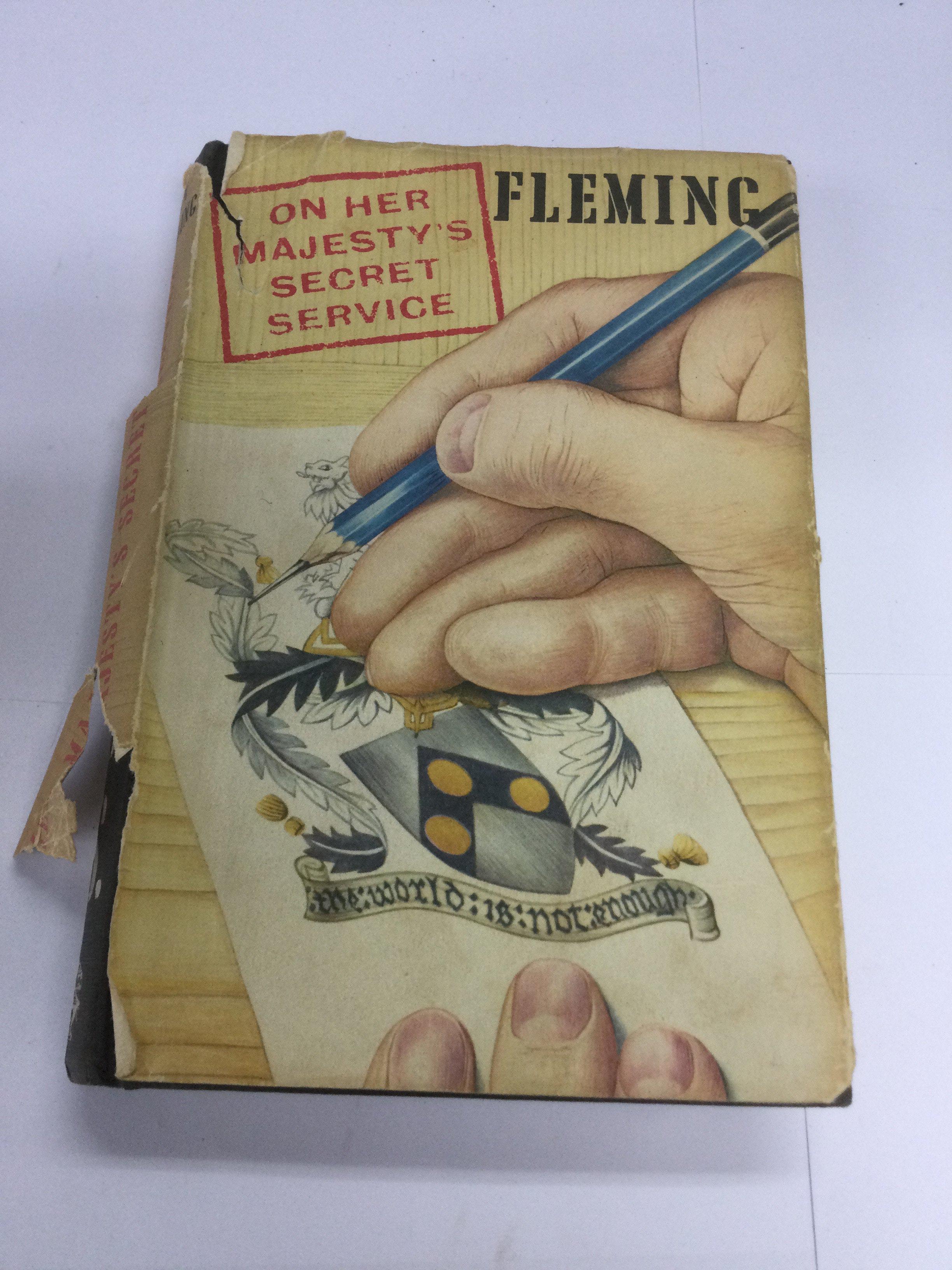 A first edition of Ian Fleming's On Her Majesty's Secret Service. Dust jacket torn.