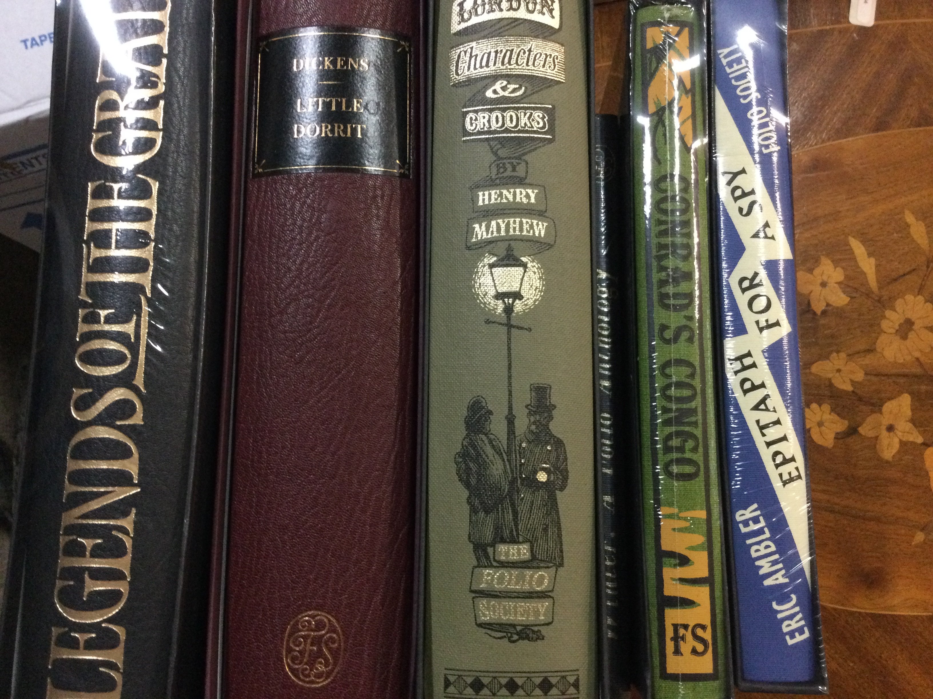 A box of books including Folio Society.