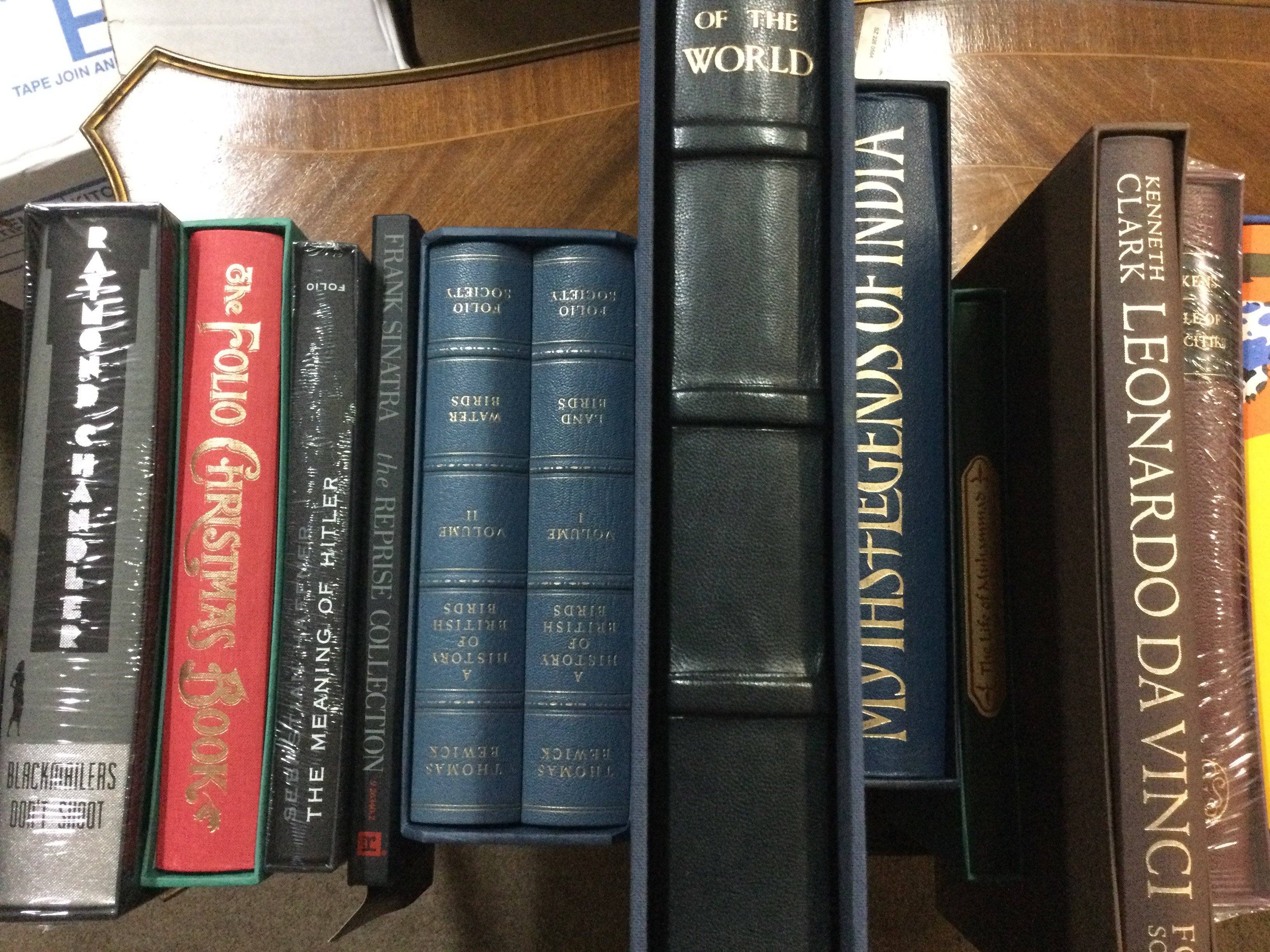 A collection of books including Folio Society .