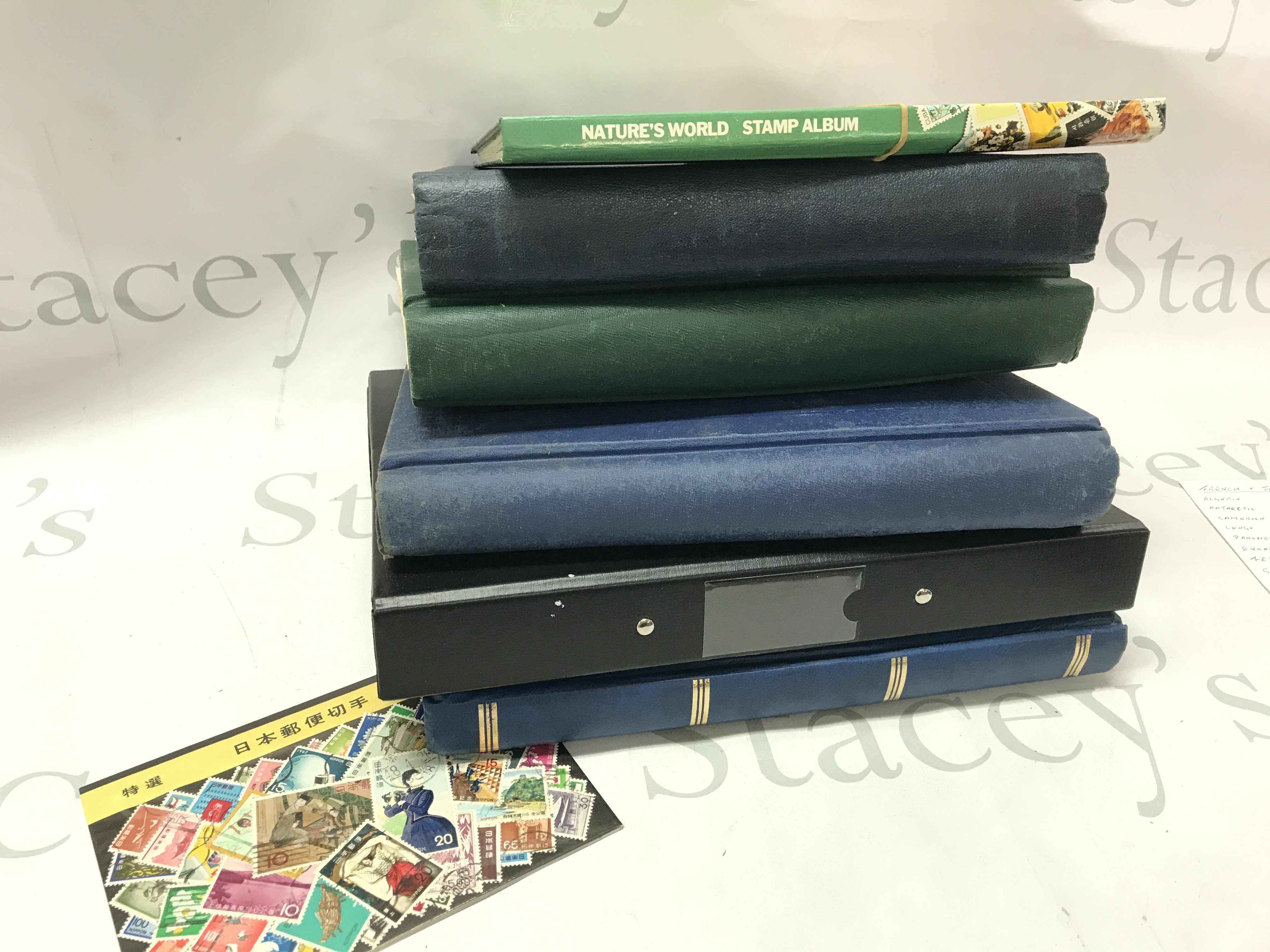 Six world stamp albums , including used and unused , some loose stamps, British colonies, Chinese stamps ,20th century southern Irish stamps etc. postage category C