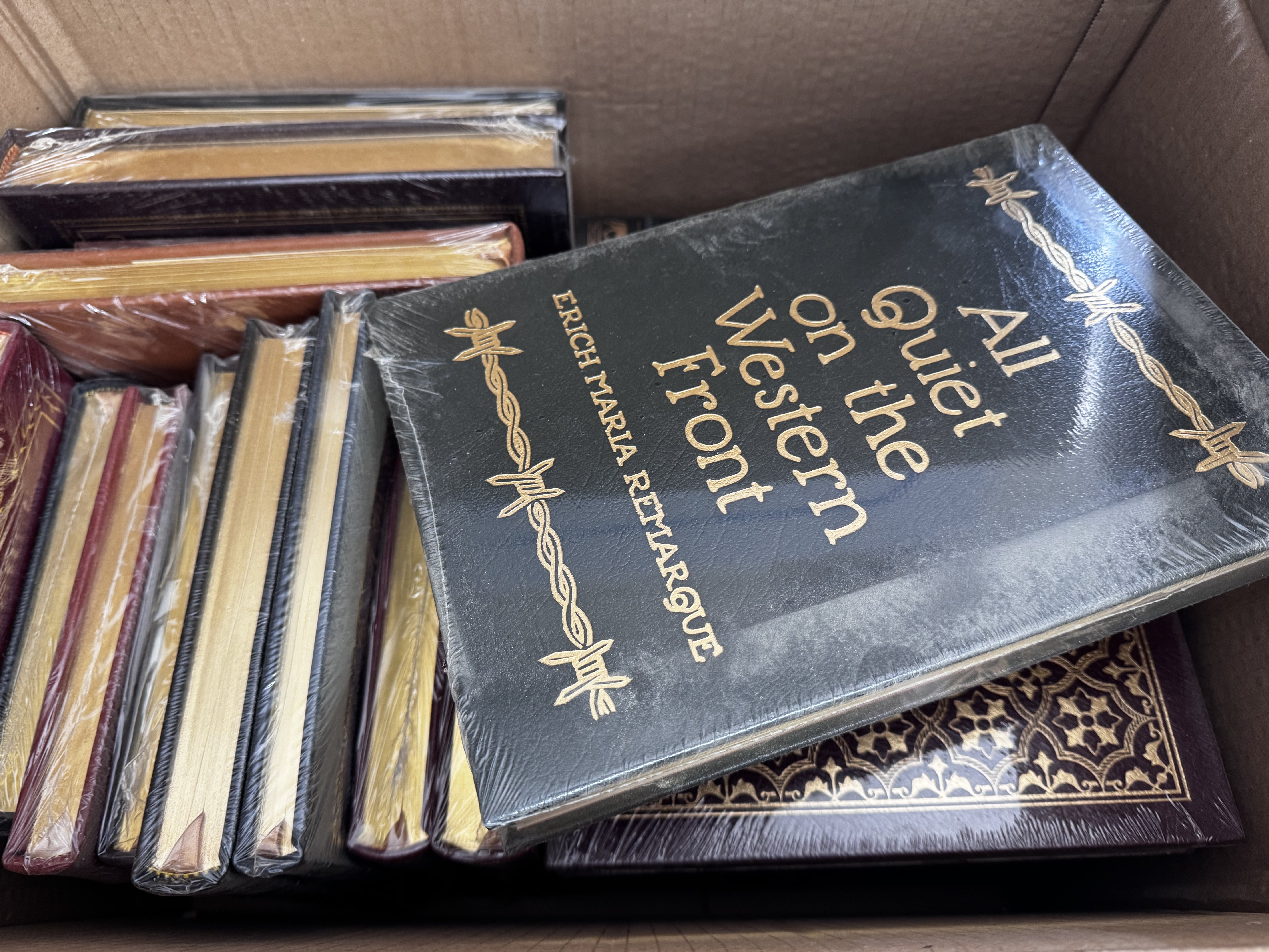 9 boxes of mostly sealed books from the Eaton press and another publishers.