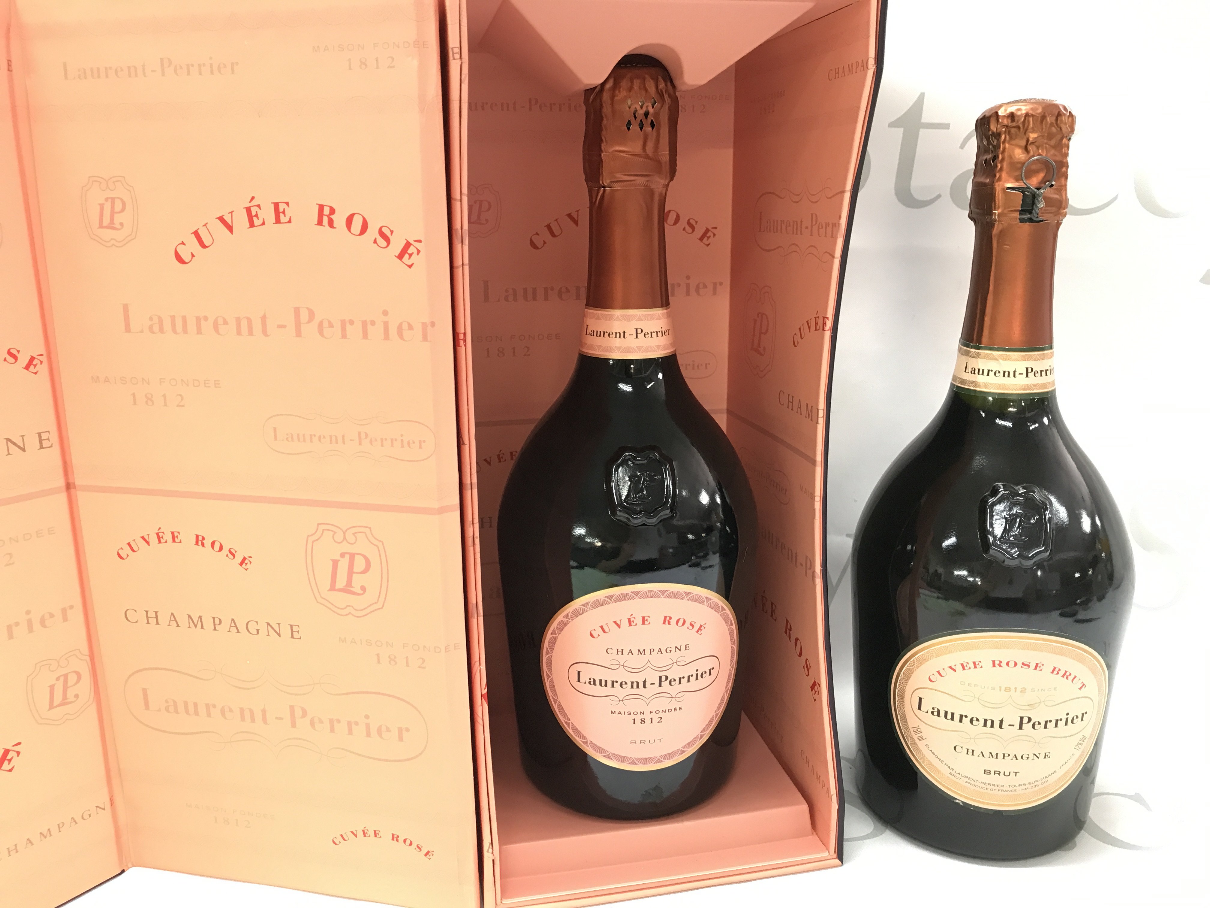 Two bottles (one boxed) Cuvee Rose champagne. This lot cannot be posted